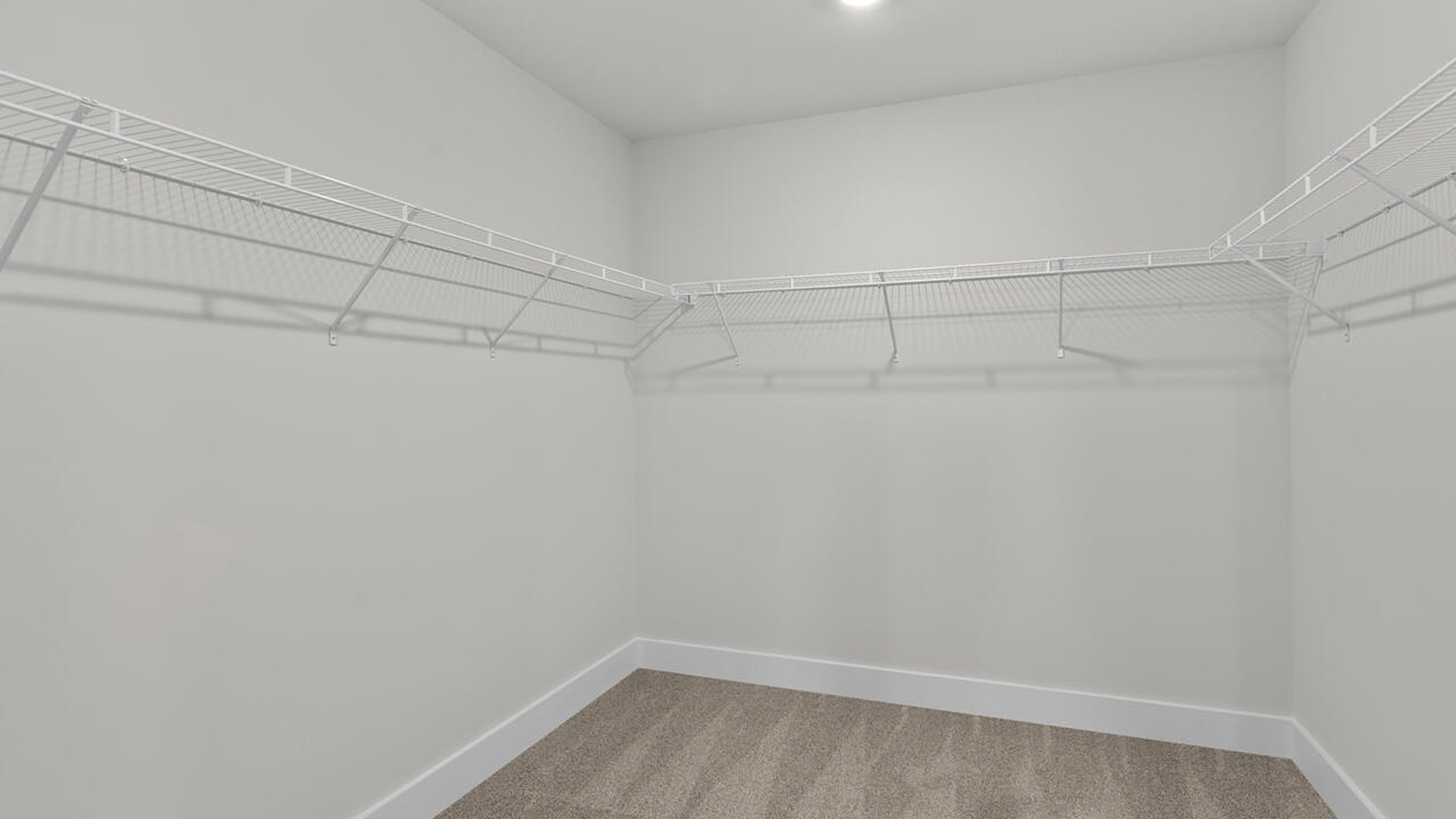 The primary suite features a sitting room, walk-in closet, a step-in 5-foot shower, dual vanity with granite countertops, and natural light in the bathroom. A large bonus room with closet also makes this home ideal for entertaining or just for extra living space.