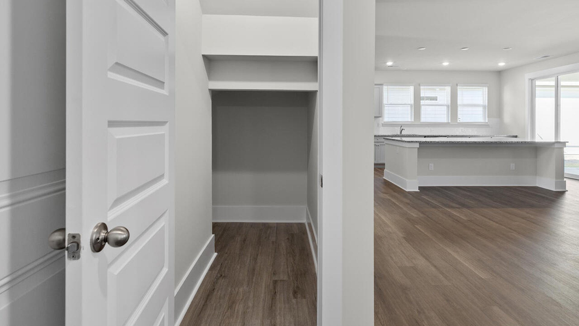There is a covered porch located off the kitchen, as well as a guest suite on the first floor.
