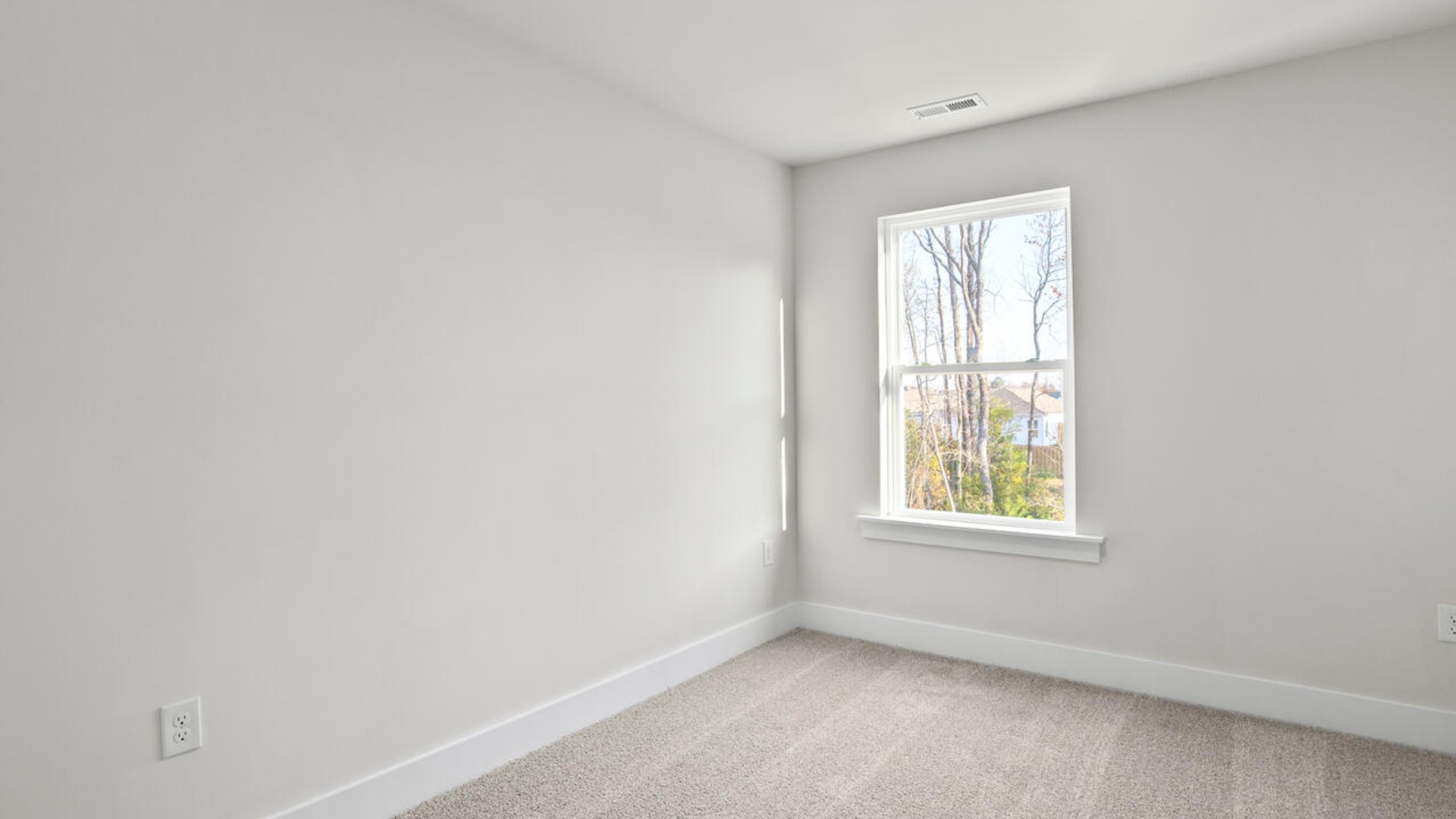 It also includes two additional bedrooms, a shared bathroom, and a laundry room for convenience.