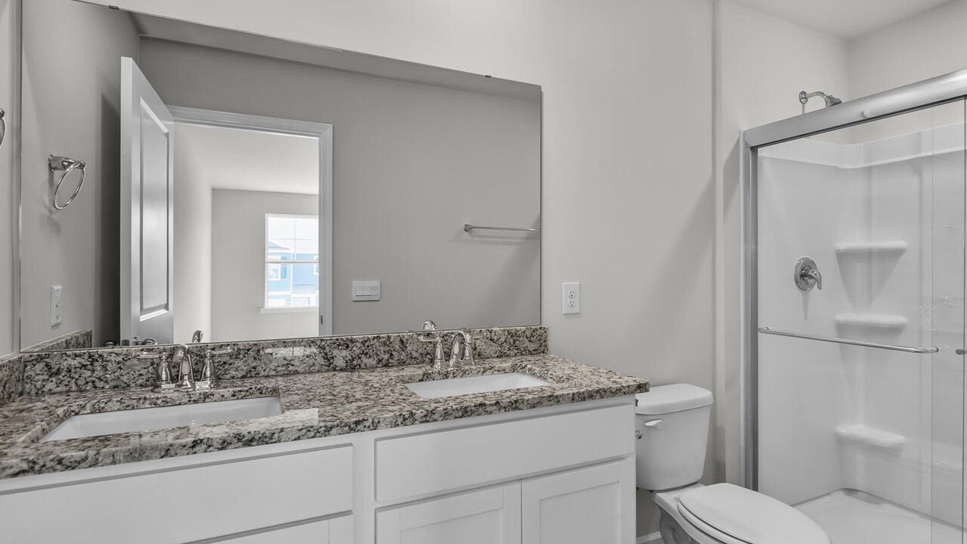 The second floor features the primary bedroom with a walk-in closet and double vanities.
