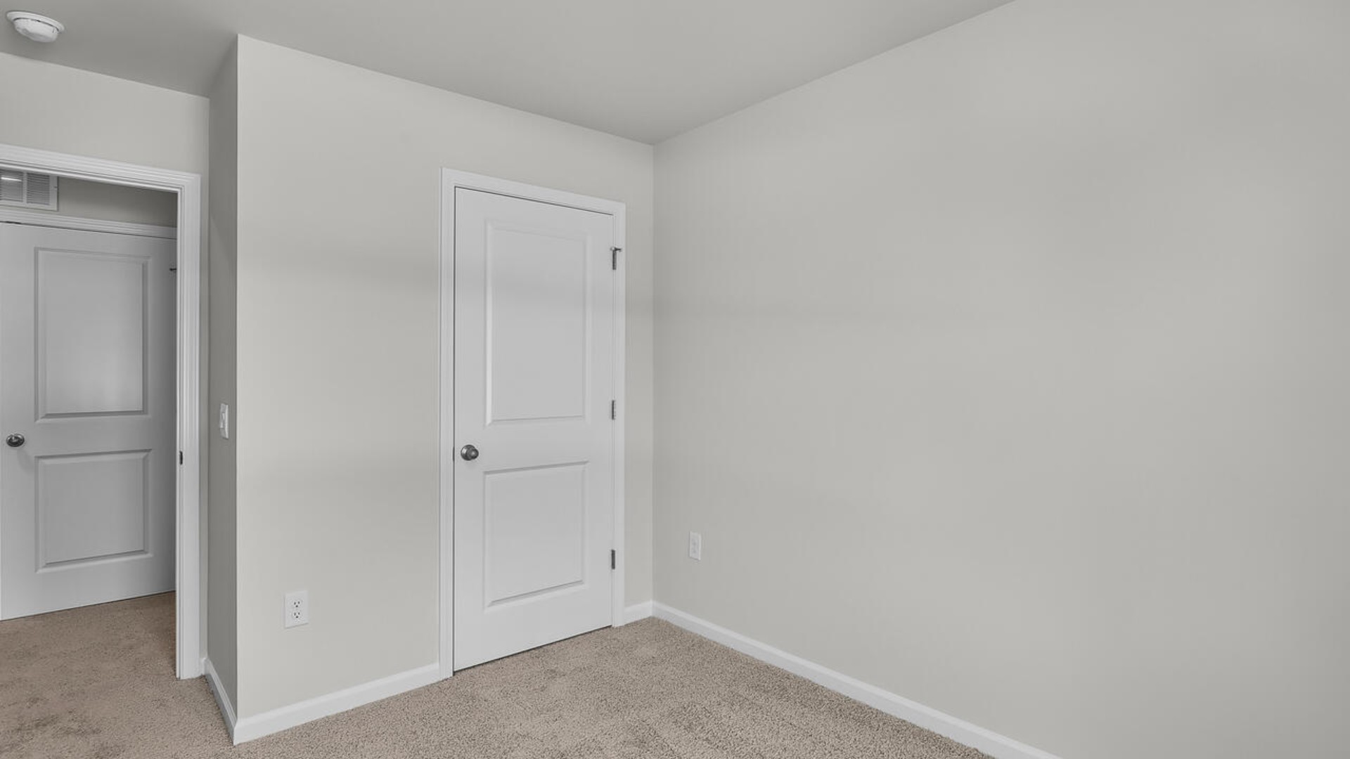 It also includes two additional bedrooms, a shared bathroom, and a laundry room for convenience