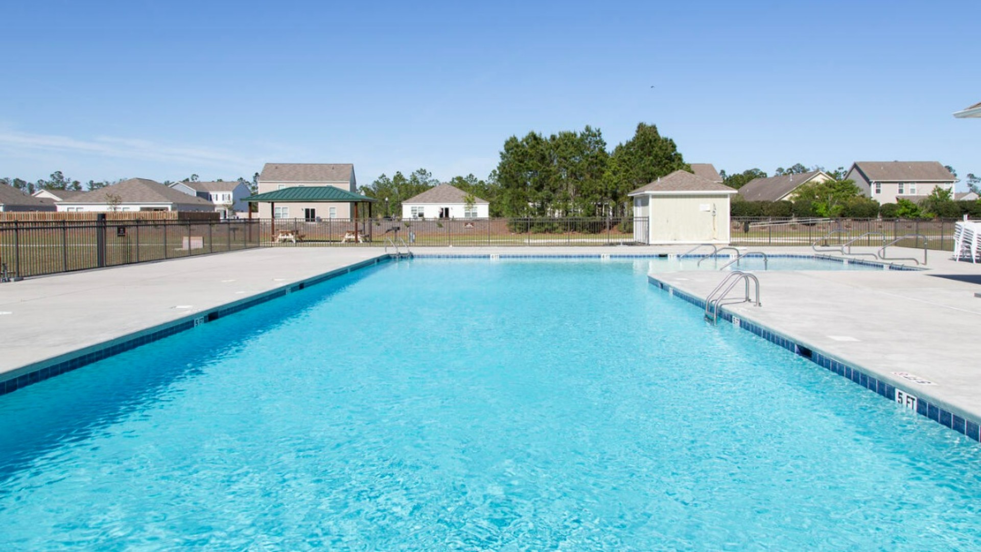 Homeowners enjoy the community amenities a pool, pavilion, fire pit, playground, and grill stations. T