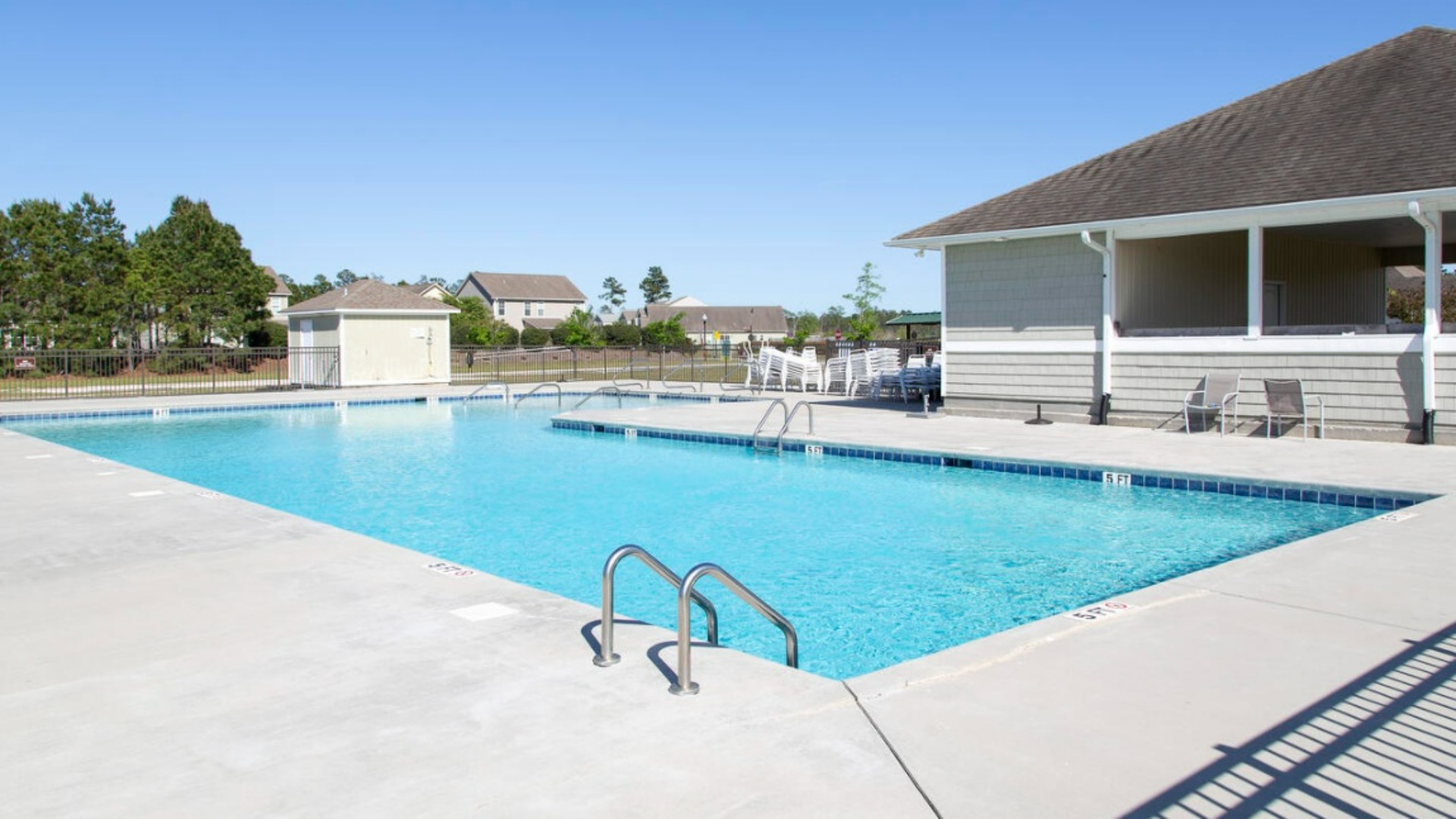 Homeowners enjoy the community amenities a pool, pavilion, fire pit, playground, and grill stations. T