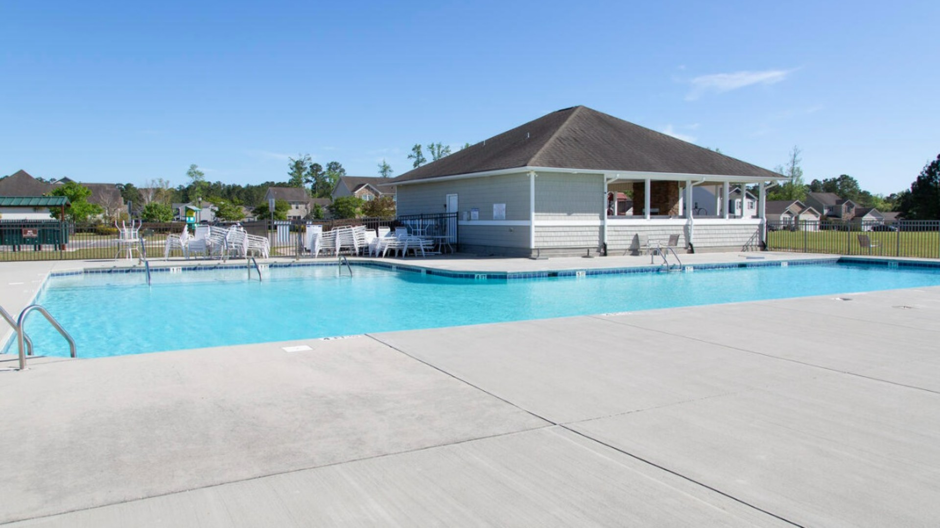 Homeowners enjoy the community amenities a pool, pavilion, fire pit, playground, and grill stations. T