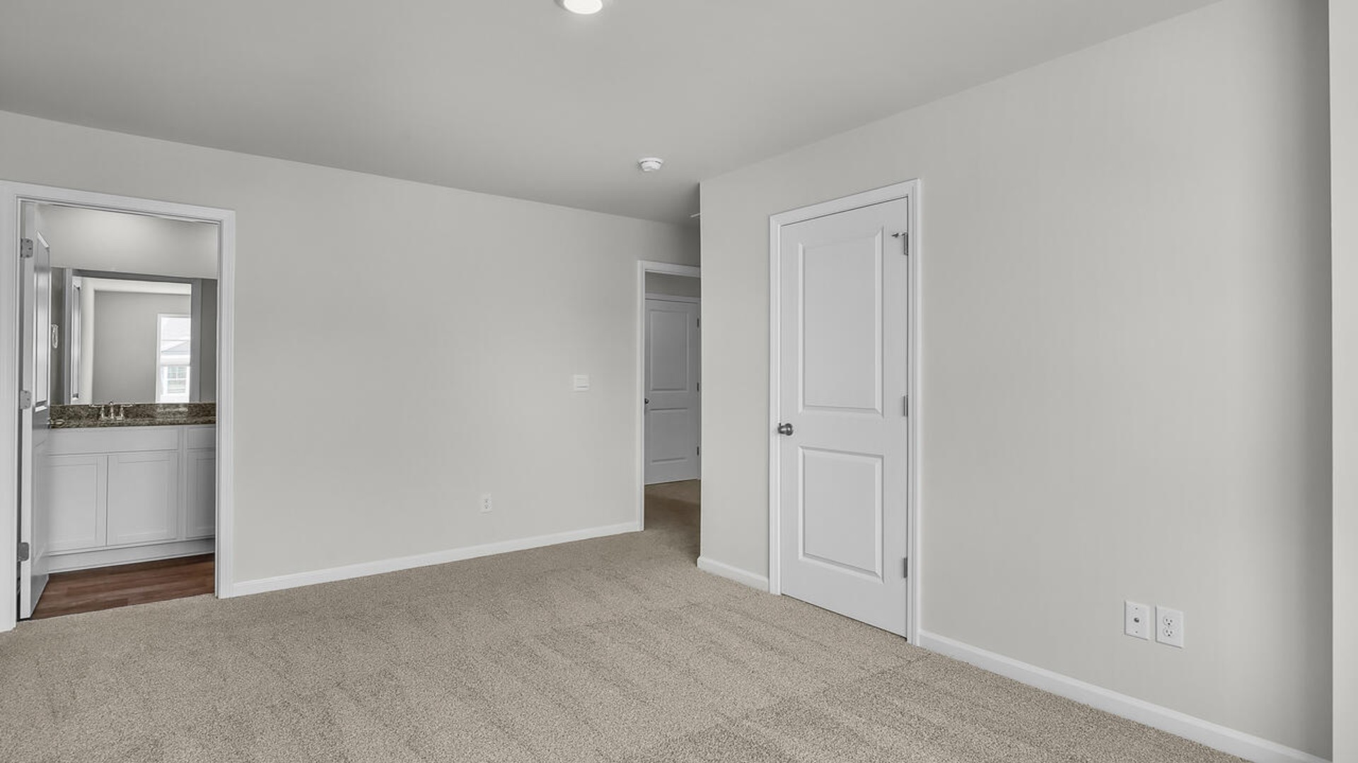 The second floor features the primary bedroom with a walk-in closet and double vanities.