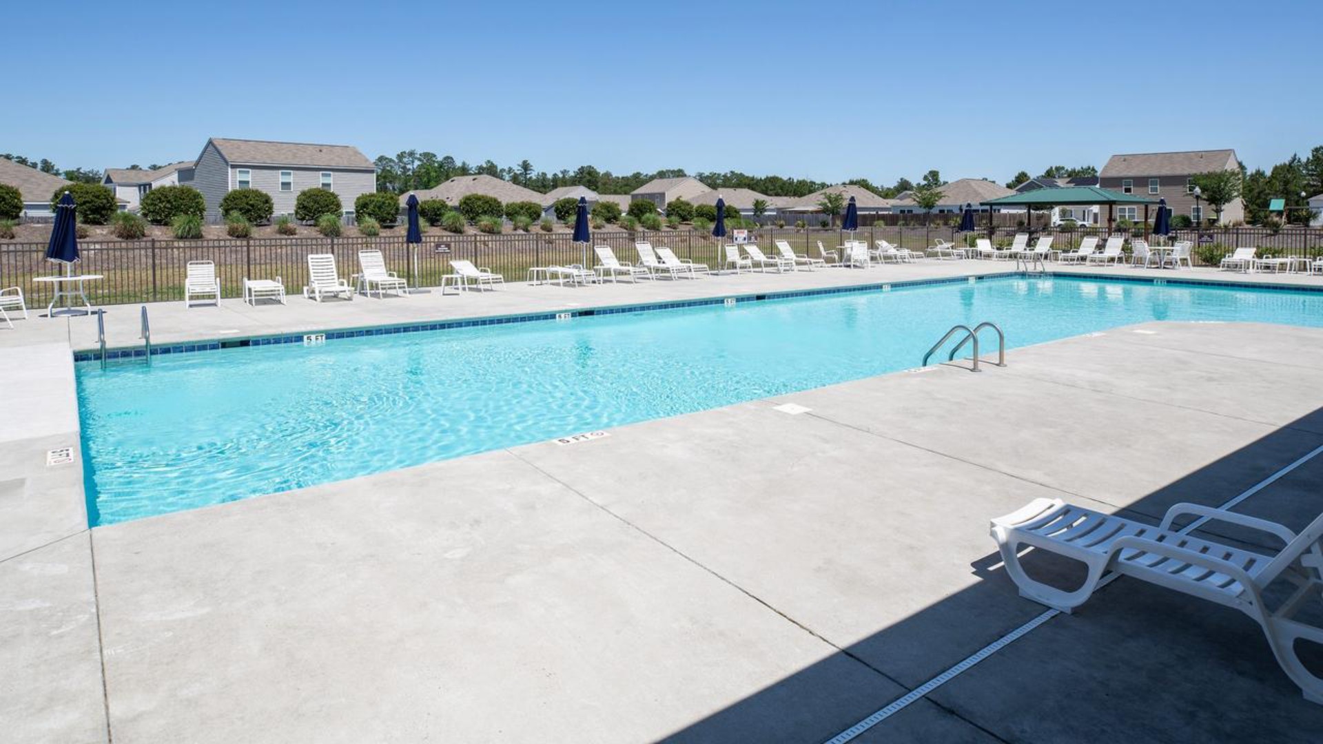 Homeowners enjoy the community amenities a pool, pavilion, fire pit, playground, and grill stations. T
