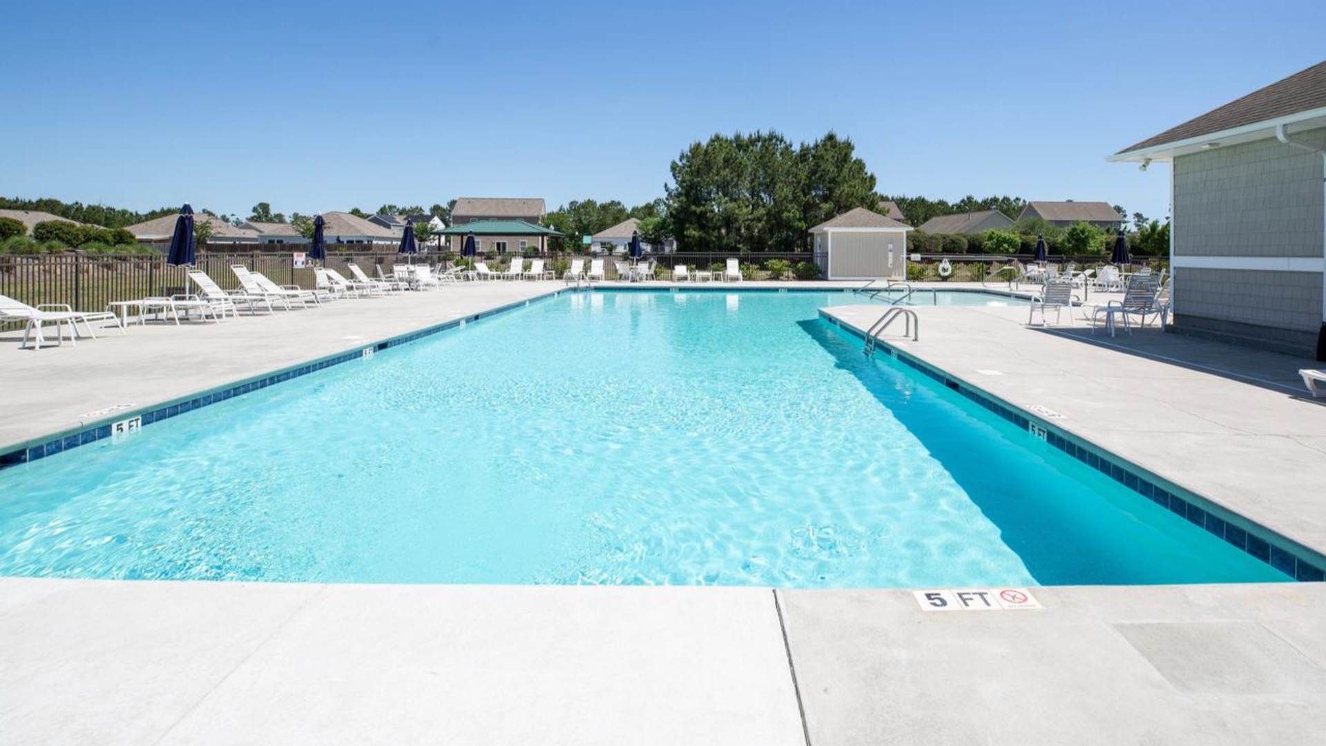 Homeowners enjoy the community amenities a pool, pavilion, fire pit, playground, and grill stations. T