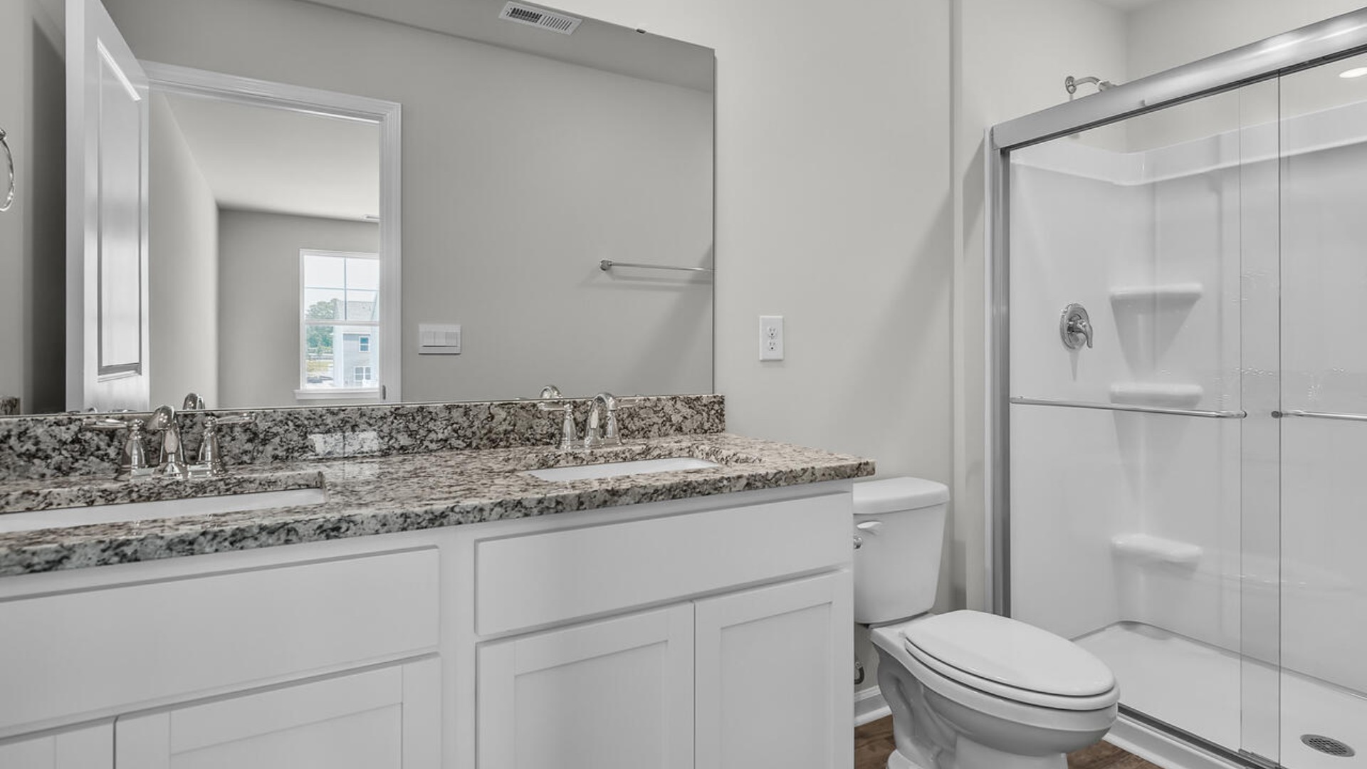 The second floor features the primary bedroom with a walk-in closet and double vanities.