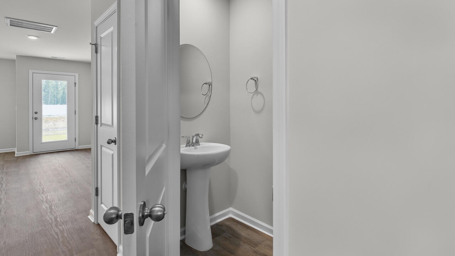 The second floor features the primary bedroom with a walk-in closet and double vanities.