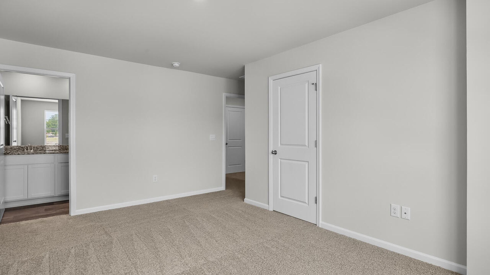 The second floor features the primary bedroom with a walk-in closet and double vanities.