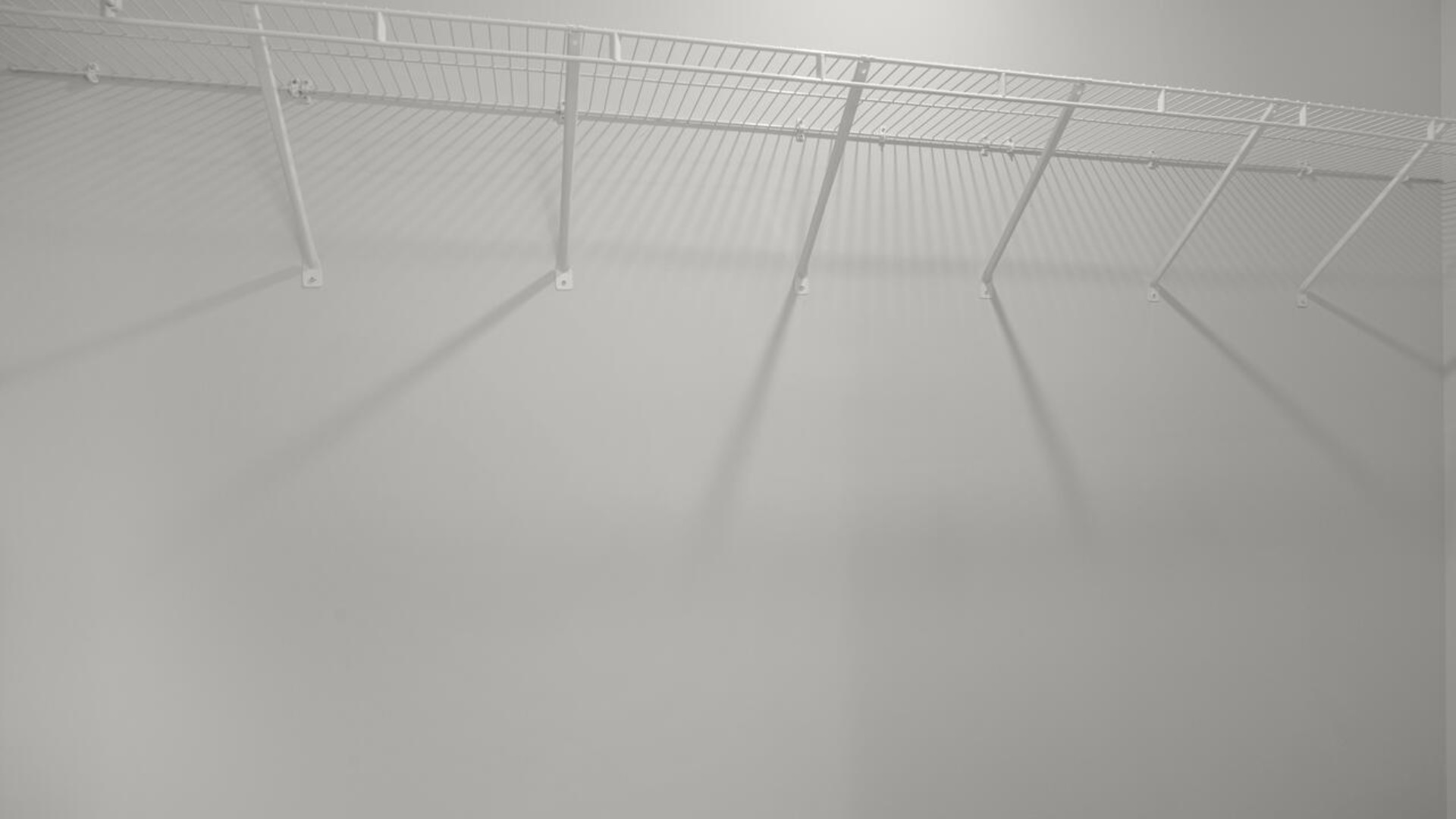 The second floor features the primary bedroom with a walk-in closet and double vanities. It also includes two additional bedrooms, a shared bathroom, and a laundry room for convenience.