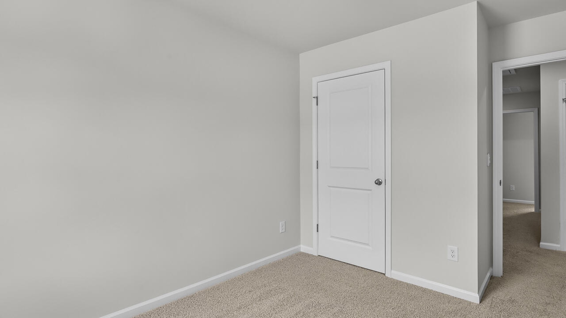 The second floor features the primary bedroom with a walk-in closet and double vanities. It also includes two additional bedrooms, a shared bathroom, and a laundry room for convenience.