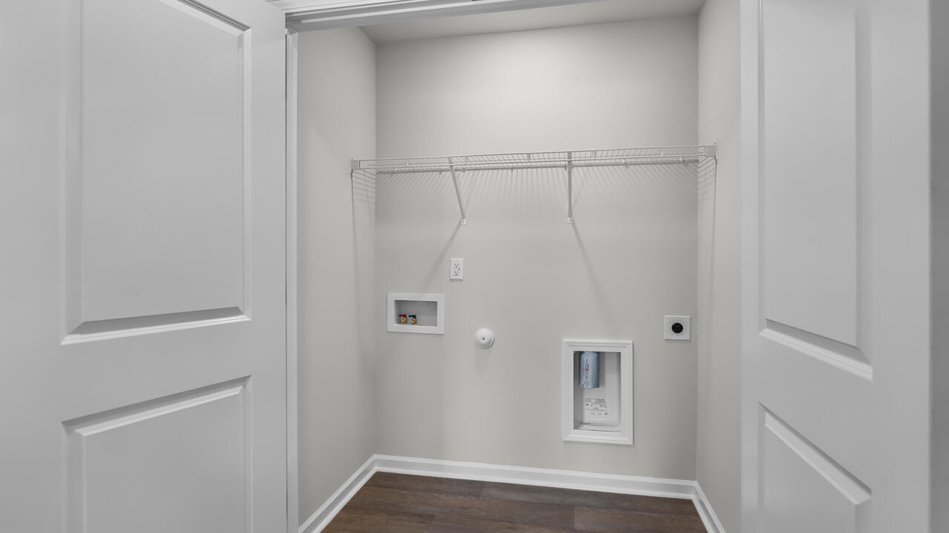 It also includes two additional bedrooms, a shared bathroom, and a laundry room for convenience. The bathrooms are equally elegant, featuring matching granite and a primary suite with a glass shower that feels like your own personal spa.