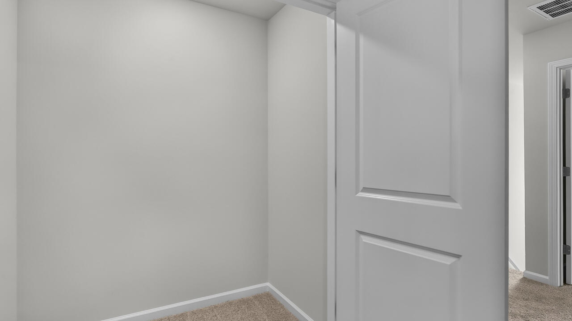 It also includes two additional bedrooms, a shared bathroom, and a laundry room for convenience. The bathrooms are equally elegant, featuring matching granite and a primary suite with a glass shower that feels like your own personal spa.