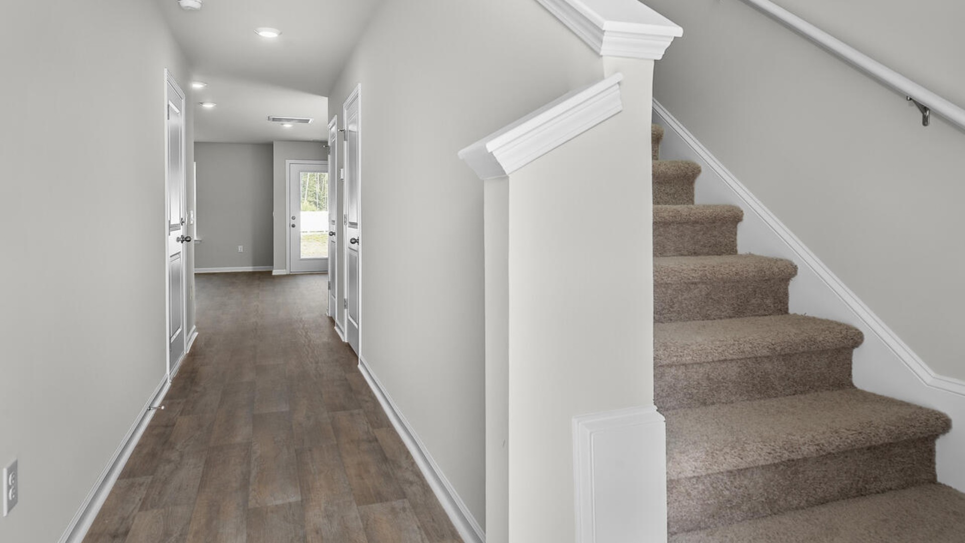 The second floor features the primary bedroom with a walk-in closet and double vanities. I