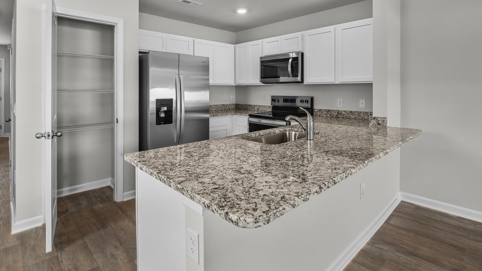 Step inside and discover a bright and airy open floor plan designed for both relaxing and entertaining. The kitchen is a showstopper with granite countertops, stainless steel appliances that are as durable as they are dazzling.