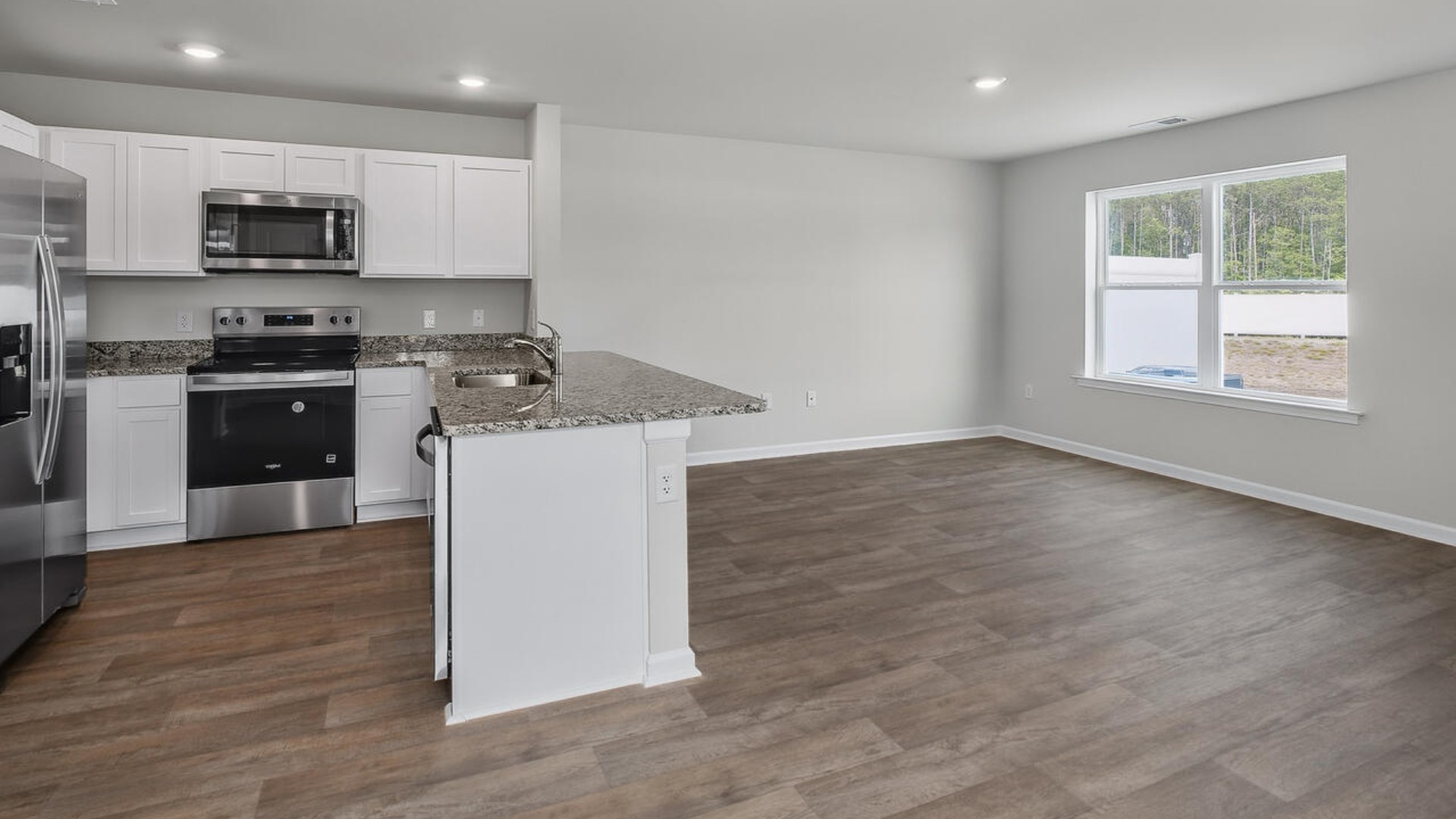 Step inside and discover a bright and airy open floor plan designed for both relaxing and entertaining. The kitchen is a showstopper with granite countertops, stainless steel appliances that are as durable as they are dazzling.