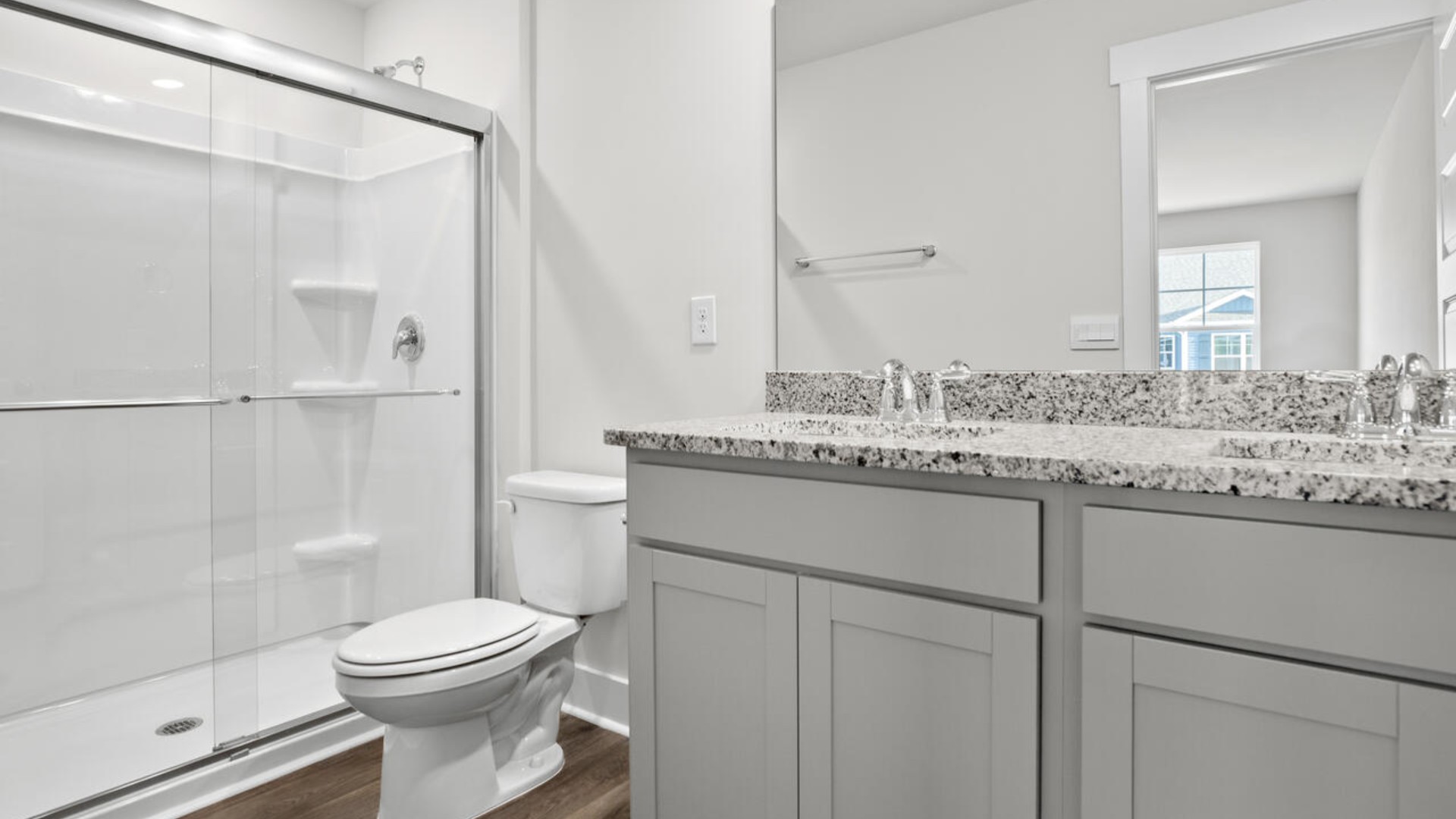 he second floor features the primary bedroom with a walk-in closet and double vanities.