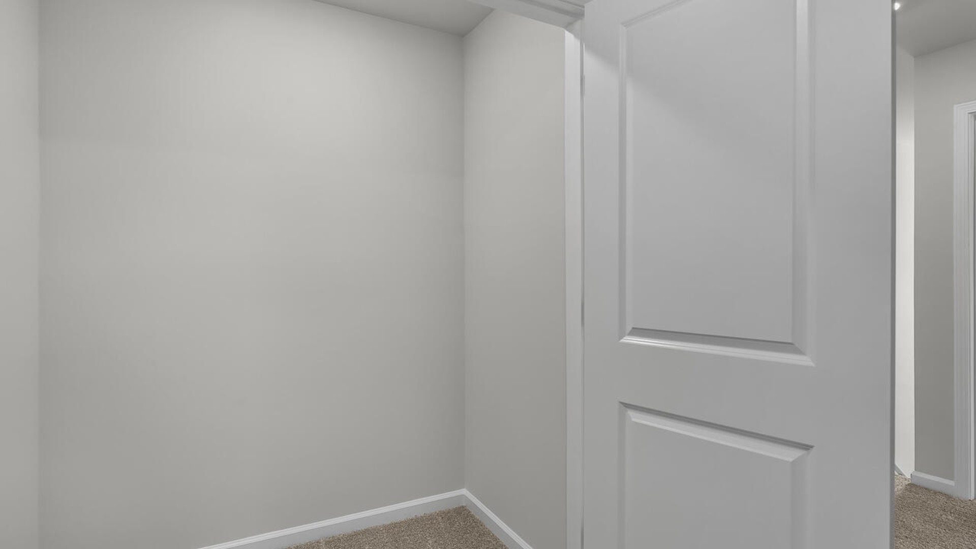 The second floor features the primary bedroom with a walk-in closet and double vanities. It also includes two additional bedrooms, a shared bathroom, and a laundry room for convenience.