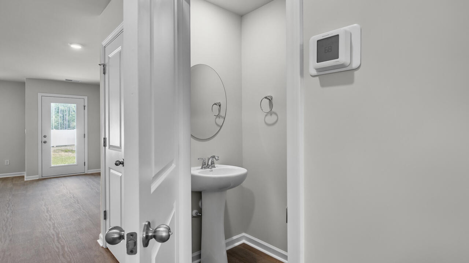 The second floor features the primary bedroom with a walk-in closet and double vanities. It also includes two additional bedrooms