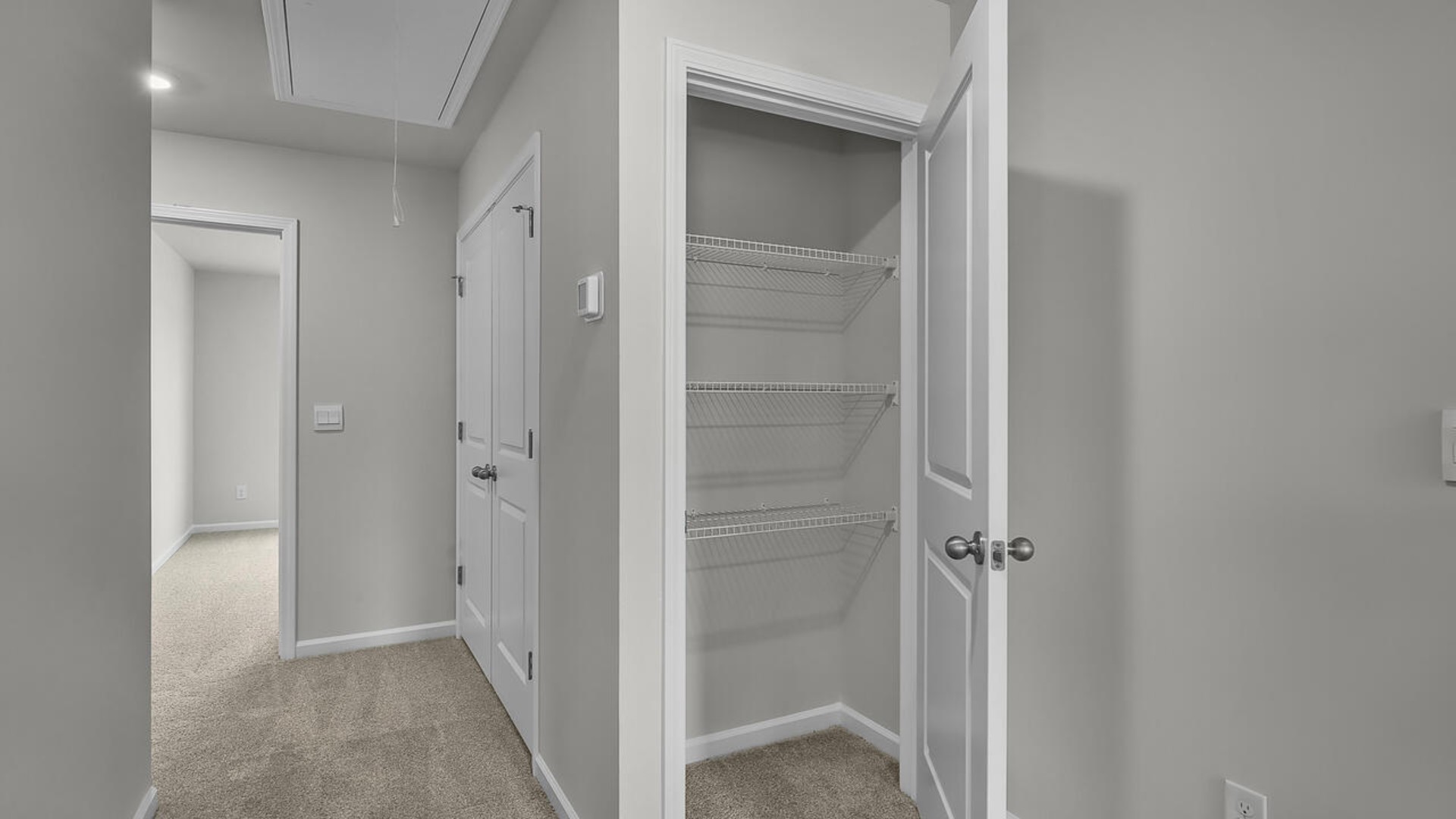 The second floor features the primary bedroom with a walk-in closet and double vanities. It also includes two additional bedrooms