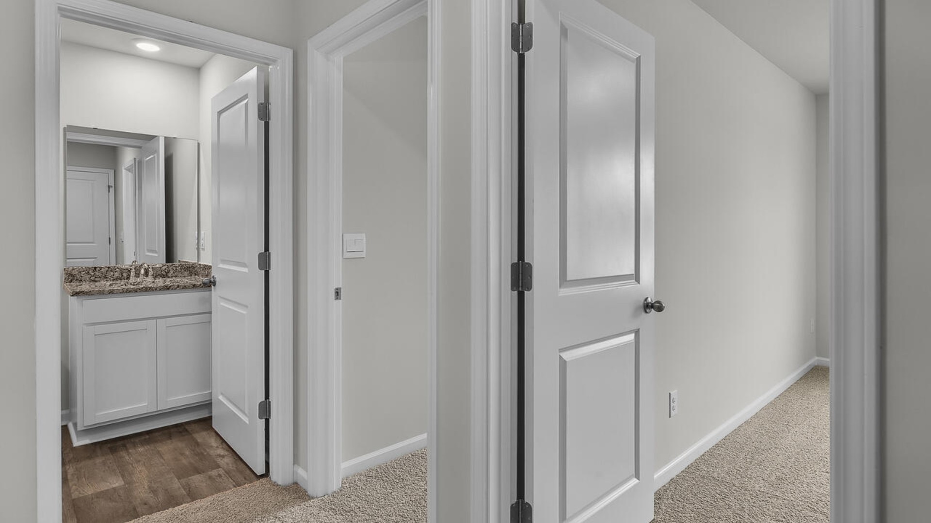 The second floor features the primary bedroom with a walk-in closet and double vanities.