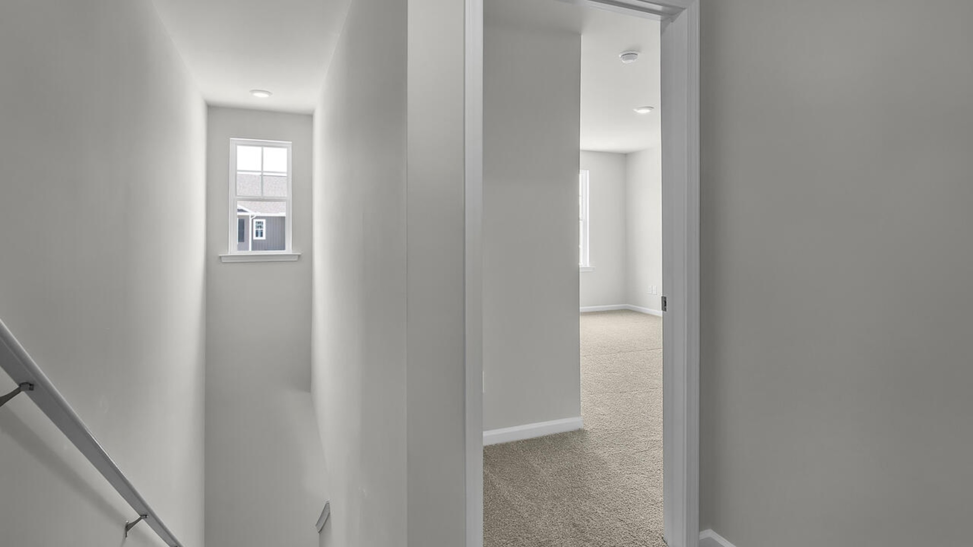 The second floor features the primary bedroom with a walk-in closet and double vanities. It also includes two additional bedrooms, a shared bathroom, and a laundry room for convenience.