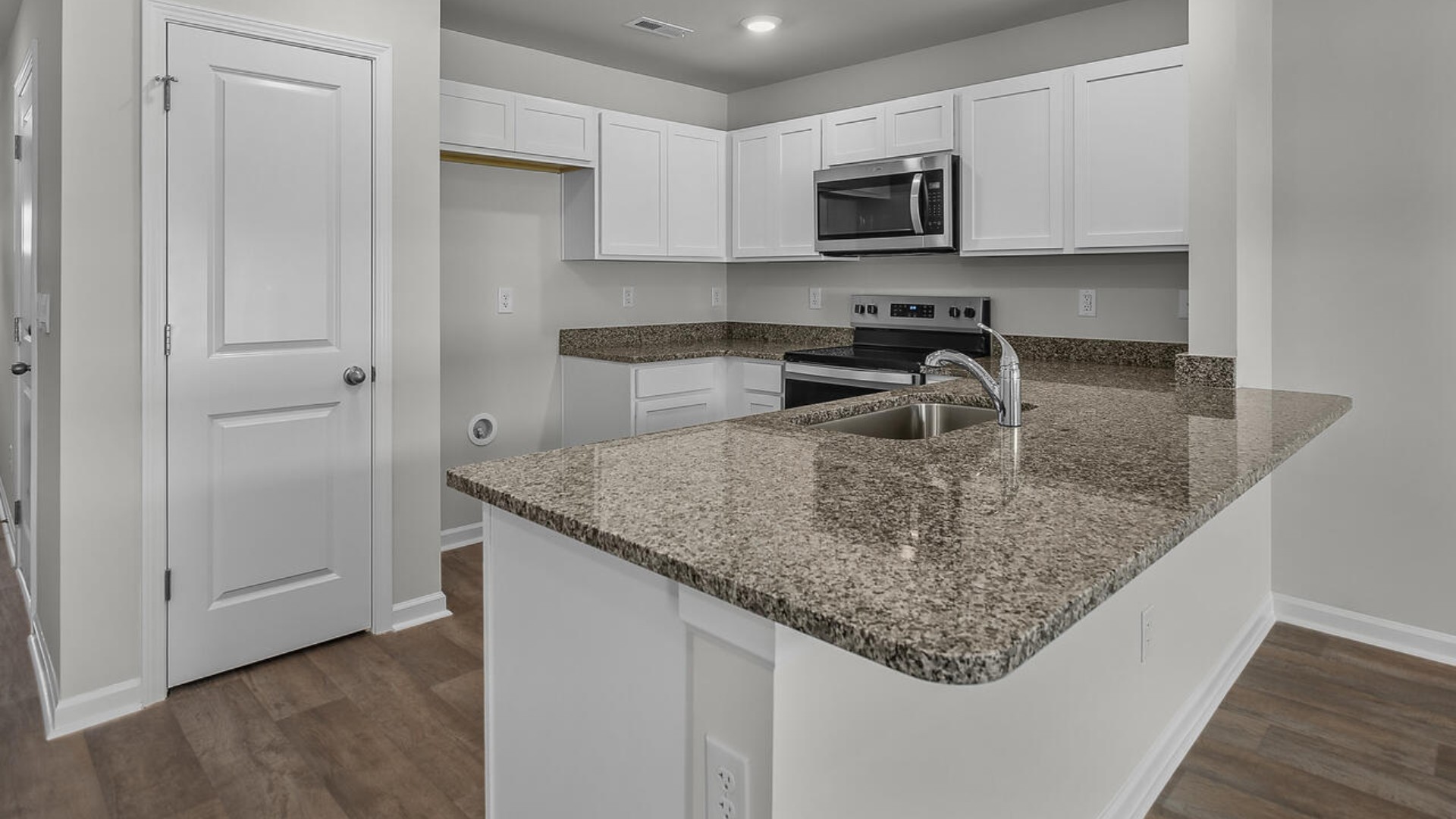 The kitchen is a showstopper with granite countertops, stainless steel appliances that are as durable as they are dazzling.
