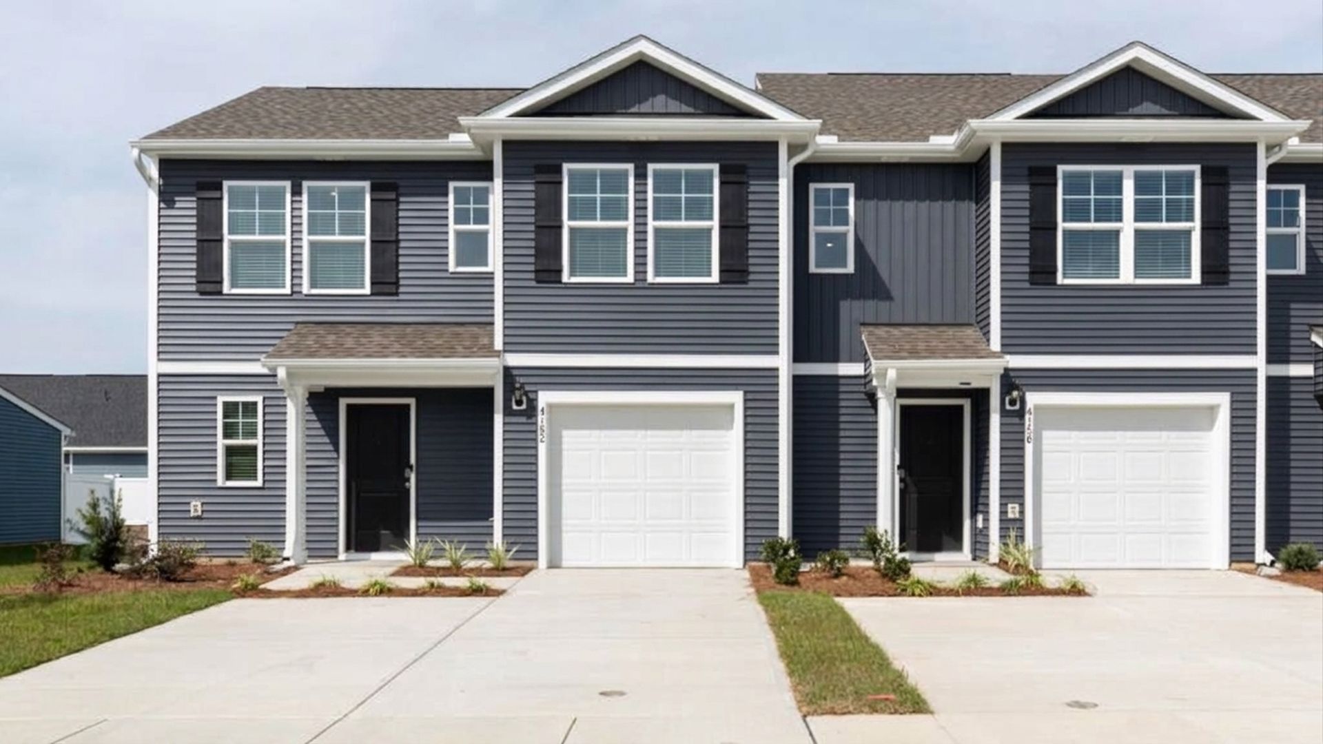 The Norman townhome with the first-floor primary bedroom is a two-story residence with 4 bedrooms and 2.5 baths, 1,763 sq ft, 1-car garage located in Leland, North Carolina in our Townes at SeaBrooke community.
