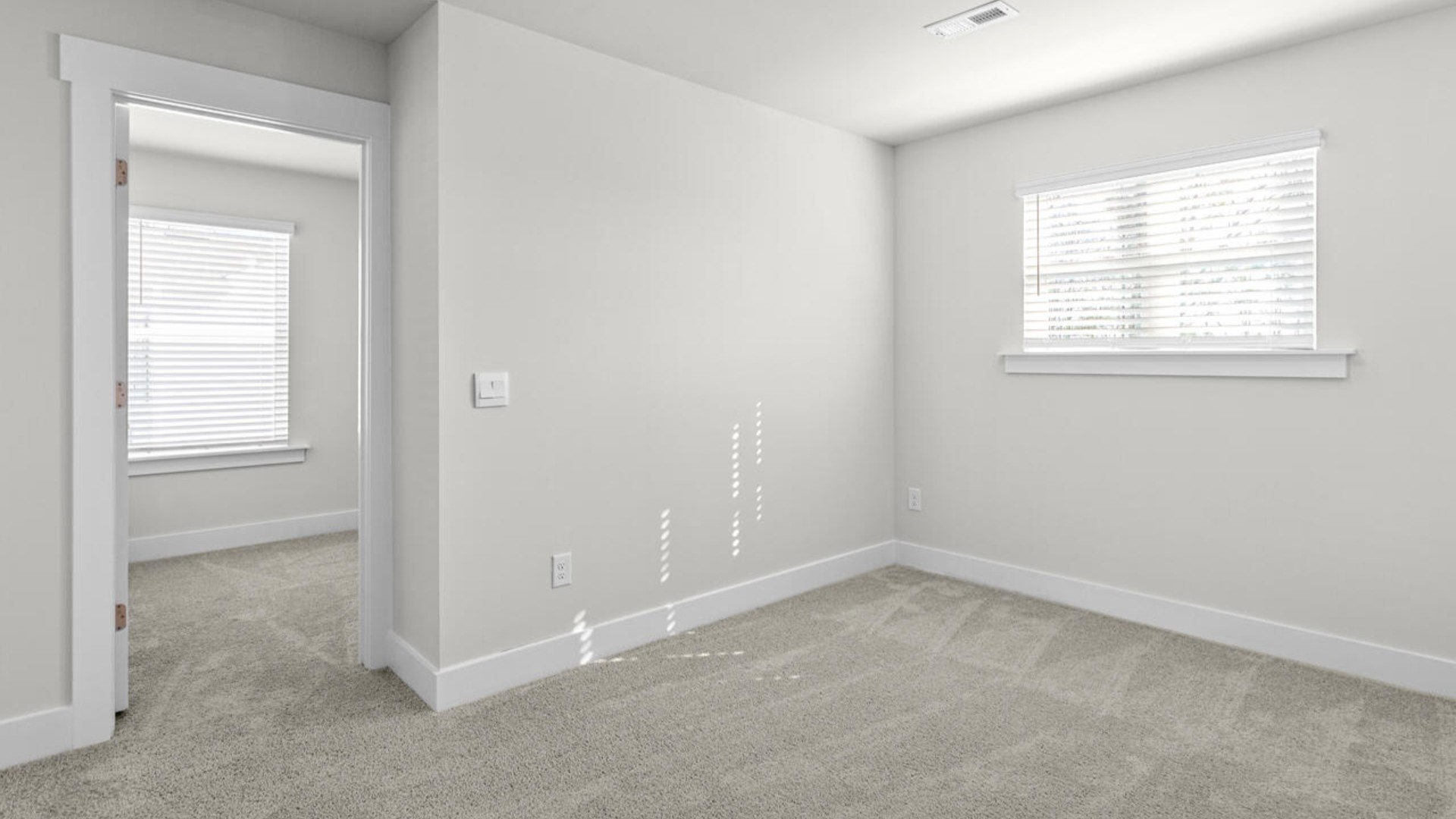 Upstairs, there are 3 more bedrooms, a shared bathroom and a loft area, adding to the flexibility of the layout. For those in search of a contemporary townhome with a functional layout, the Norman is an excellent choice.