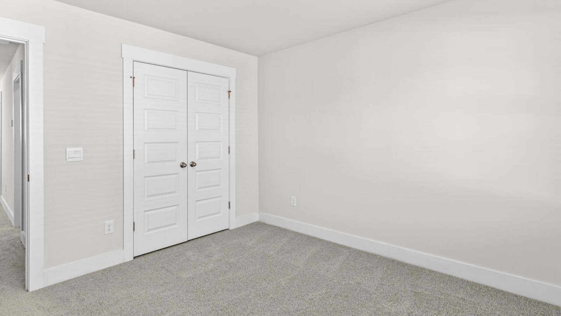 Upstairs, there are 3 more bedrooms, a shared bathroom and a loft area, adding to the flexibility of the layout. For those in search of a contemporary townhome with a functional layout, the Norman is an excellent choice.