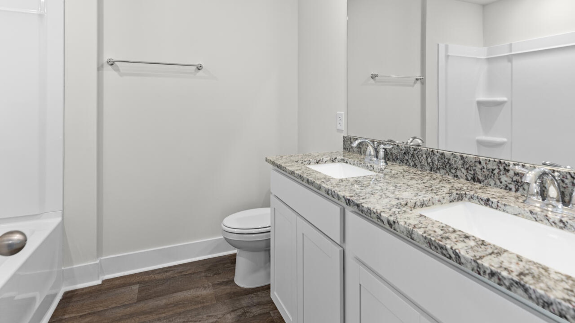 Upstairs, there are 3 more bedrooms, a shared bathroom and a loft area, adding to the flexibility of the layout. For those in search of a contemporary townhome with a functional layout, the Norman is an excellent choice.