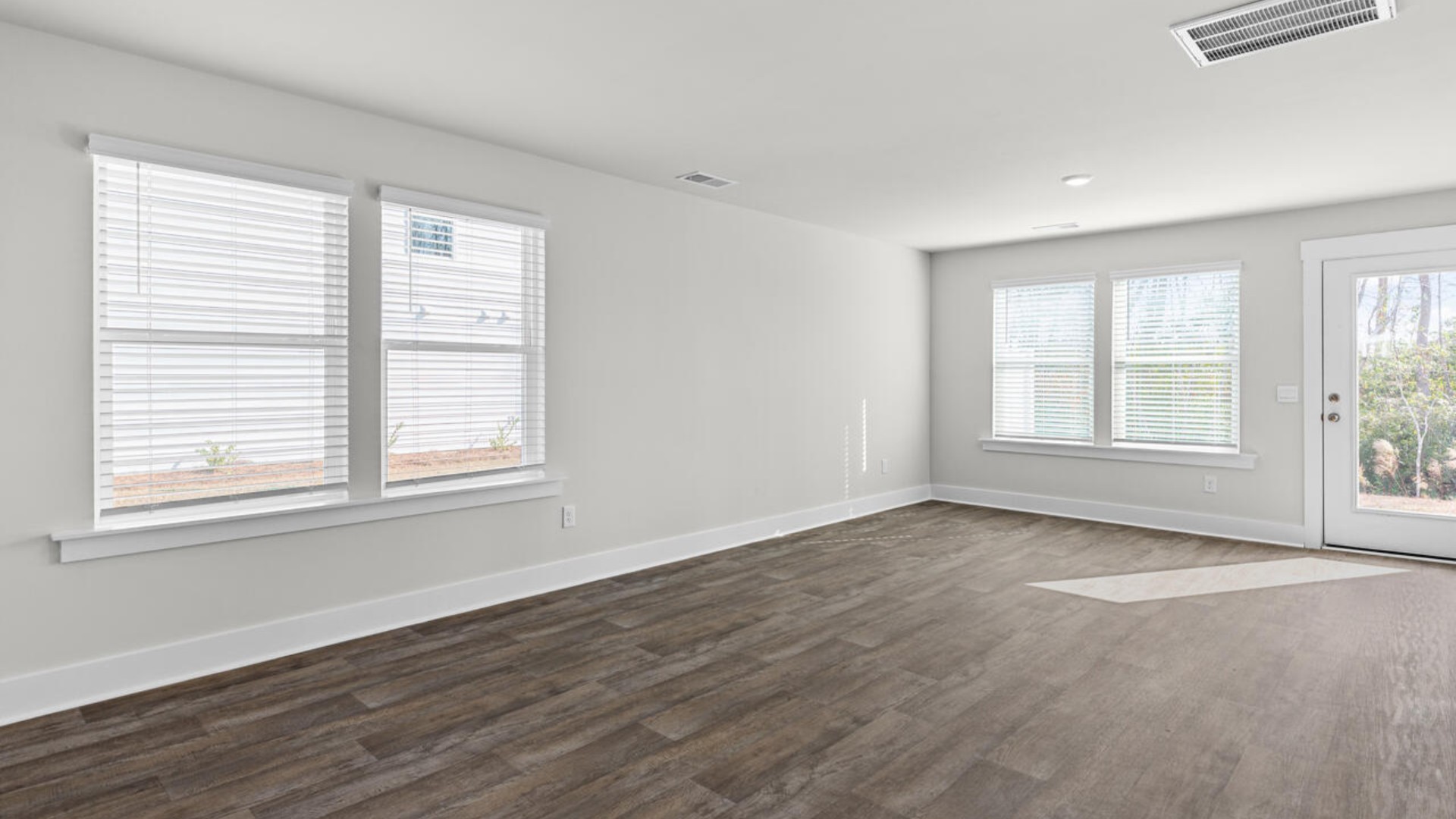 On the first floor, you'll find a spacious kitchen that flows into a light-filled living area, perfect for hosting guests.