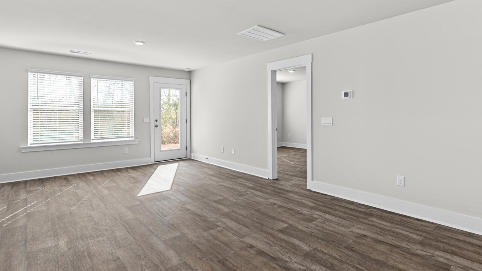 On the first floor, you'll find a spacious kitchen that flows into a light-filled living area, perfect for hosting guests.