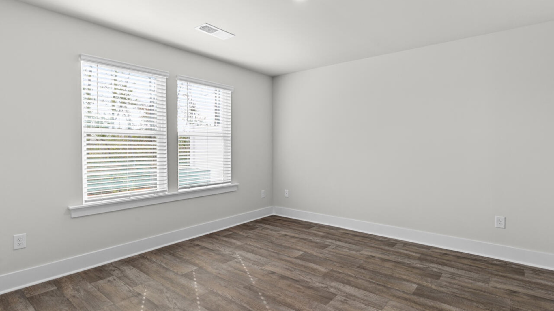 The primary suite is conveniently located just off the living room.