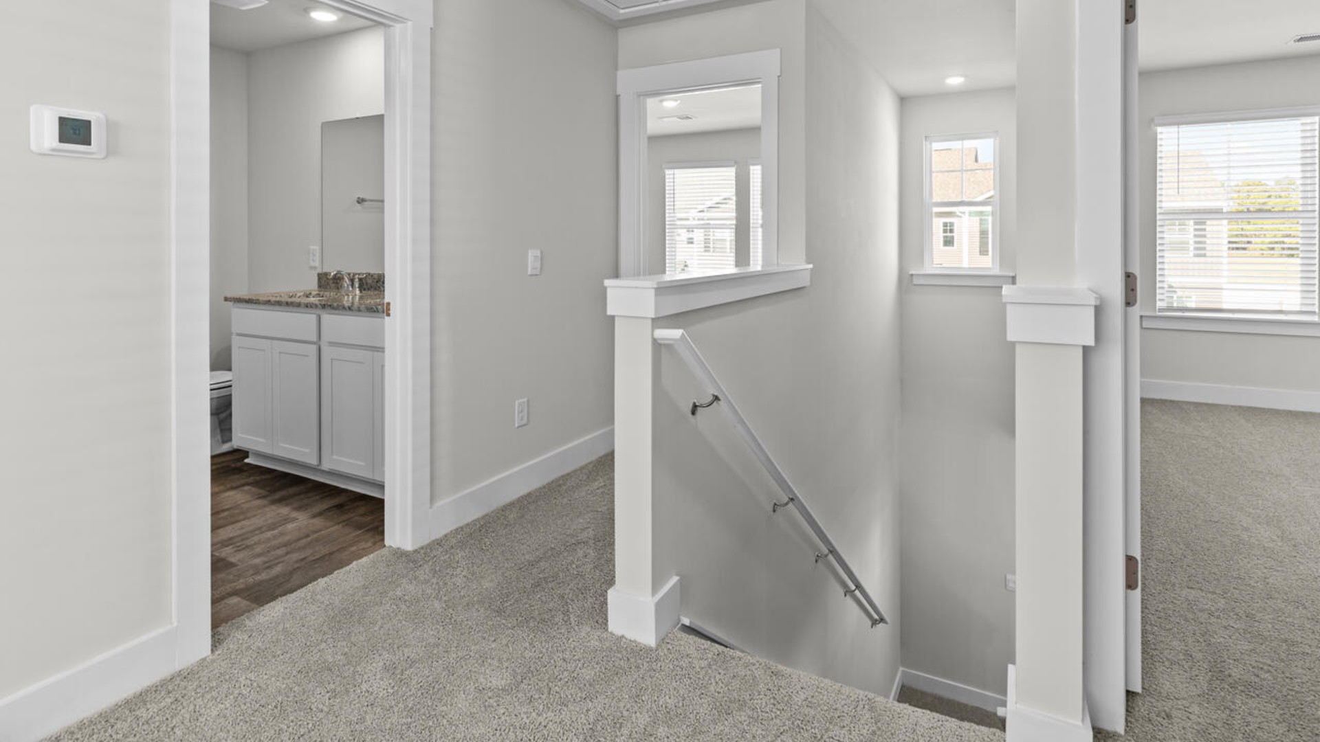 Upstairs, there are 3 more bedrooms, a shared bathroom and a loft area, adding to the flexibility of the layout. For those in search of a contemporary townhome with a functional layout, the Norman is an excellent choice.