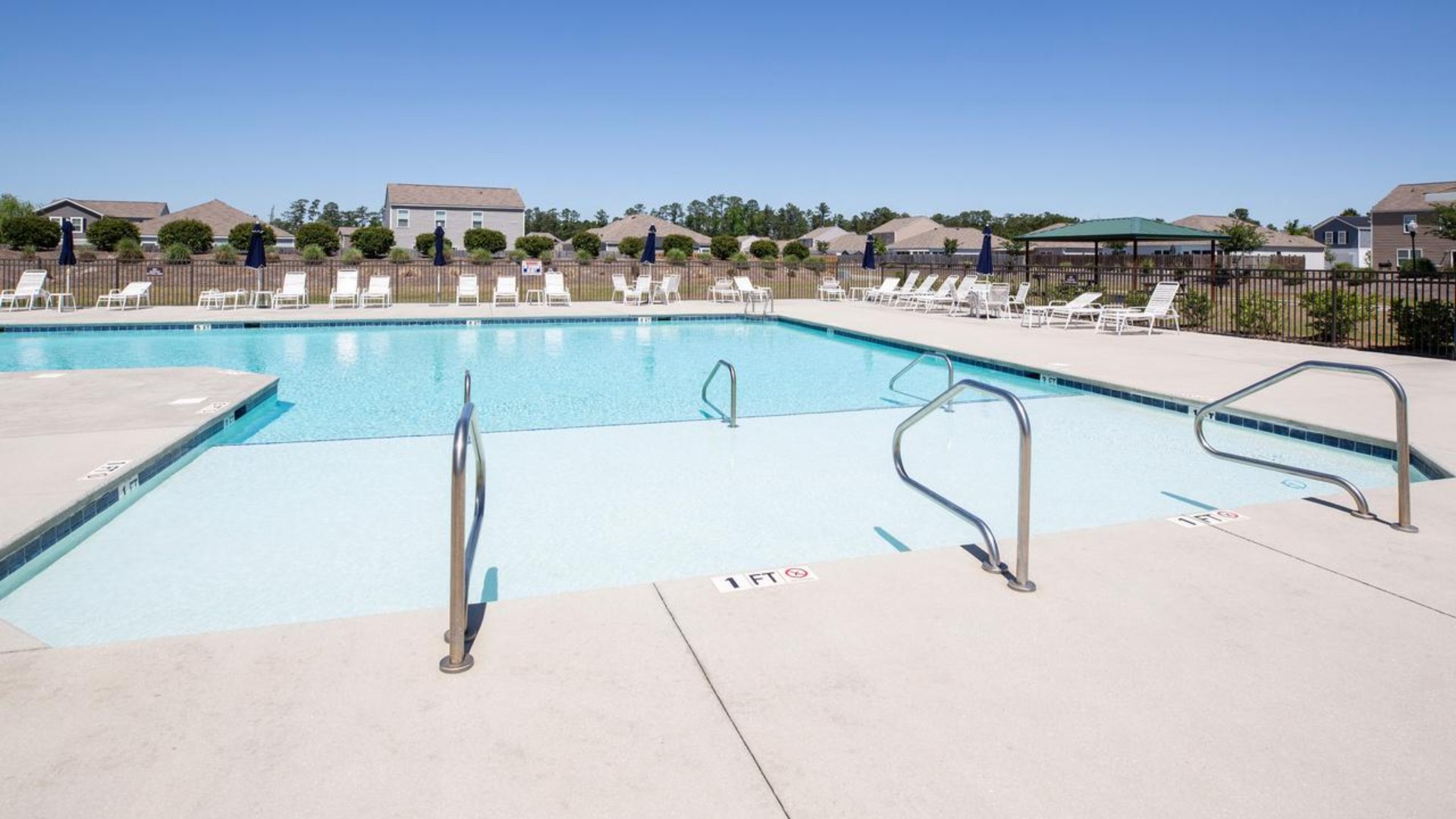 Homeowners enjoy the community amenities a pool, pavilion, fire pit, playground, and grill stations.