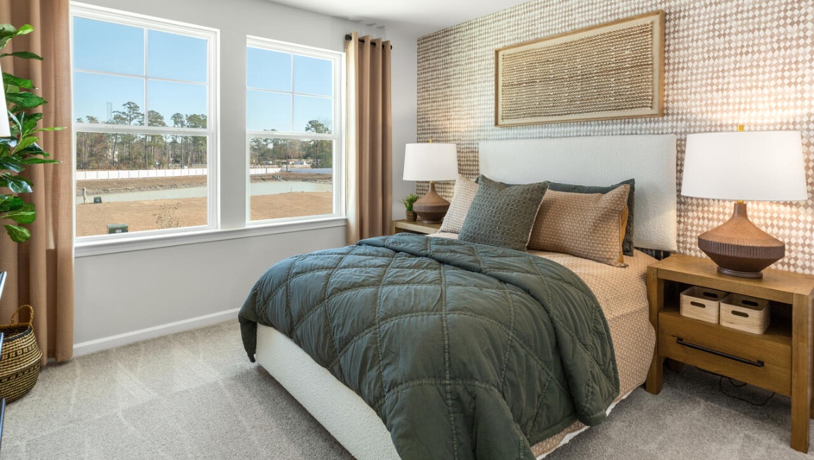The primary suite is conveniently located just off the living room. Upstairs, there are 3 more bedrooms, a shared bathroom and a loft area, adding to the flexibility of the layout.