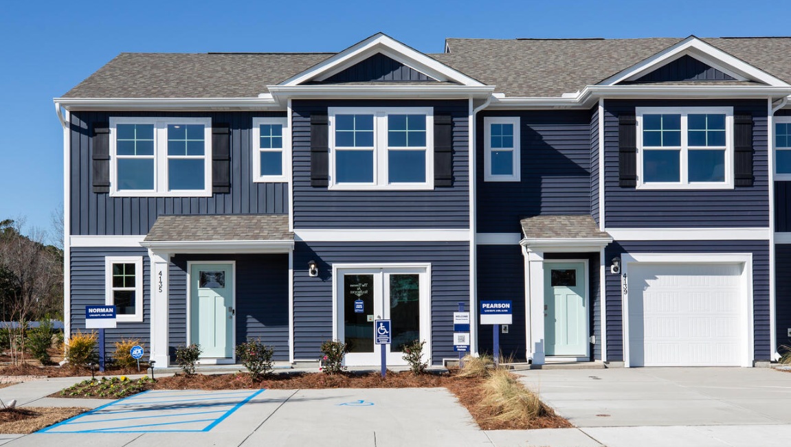 The Norman townhome is a two-story residence with 4 bedrooms and 2.5 baths. On the first floor,