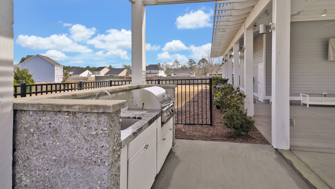 Homeowners will feel like they're on vacation when they splash in the elegant neighborhood swimming pool, lounge on the spacious sundeck and prepare a delicious meal in the outdoor grilling kitchen.
