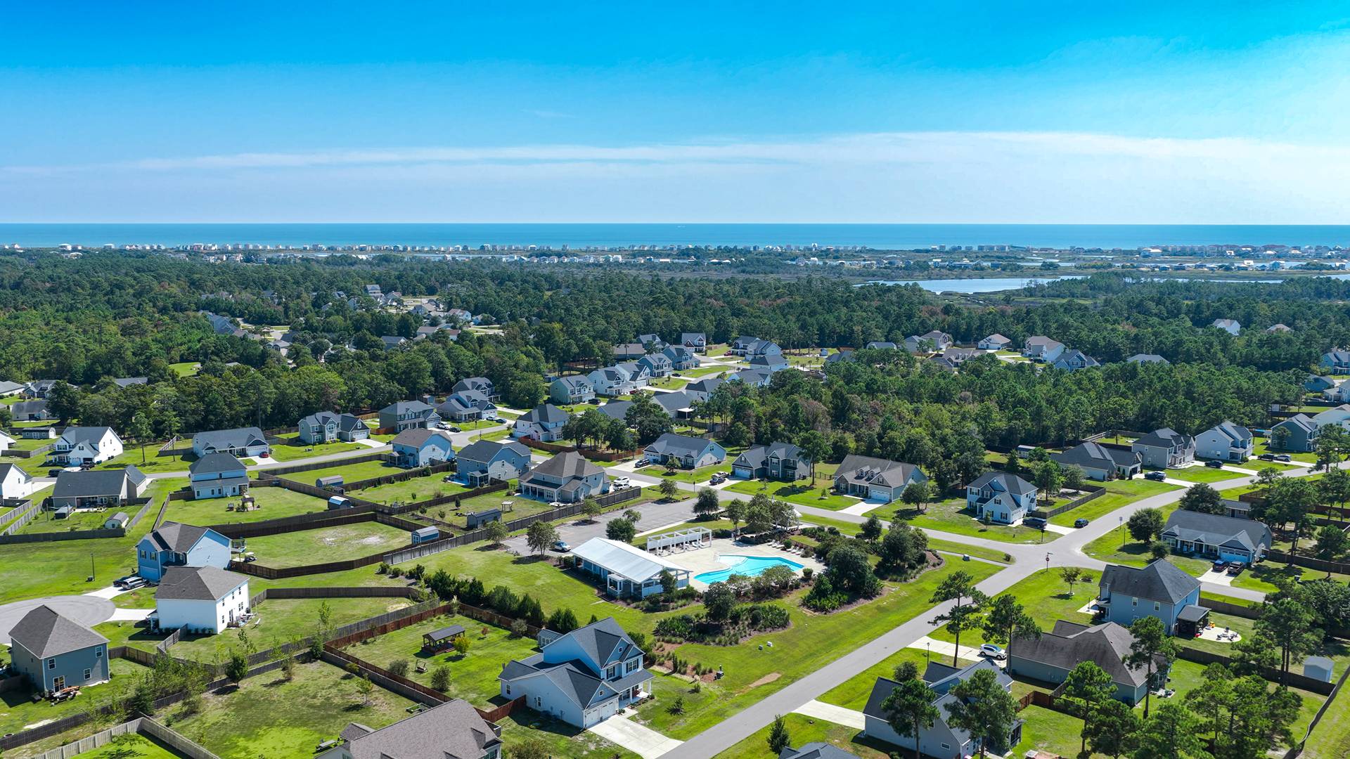 Homeowners will feel like they're on vacation when they splash in the elegant neighborhood swimming pool, lounge on the spacious sundeck and prepare a delicious meal in the outdoor grilling kitchen.