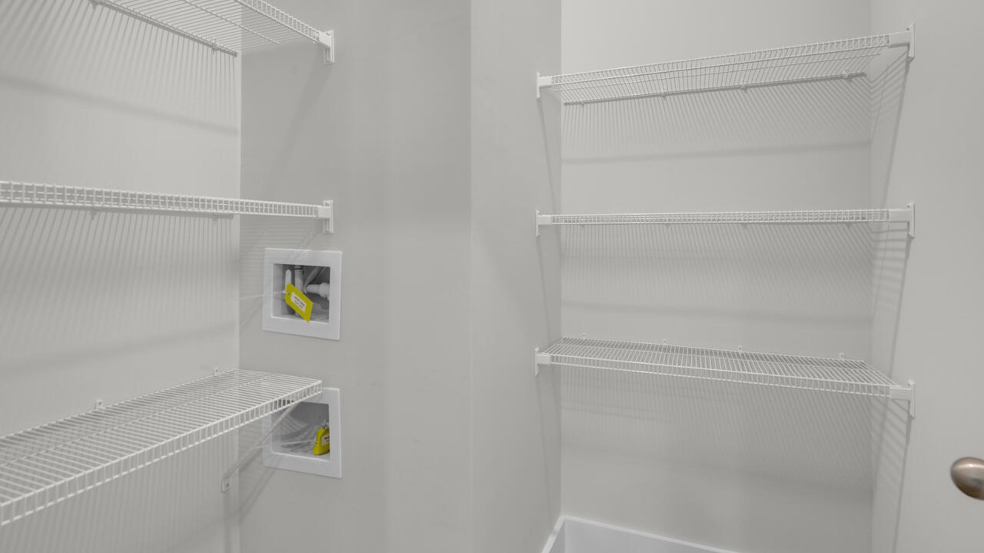 The gourmet kitchen stands out with its elegant granite countertops and Whirlpool stainless steel appliance package. Throughout the home, Luxury Vinyl Plank (LVP) flooring and stain-resistant carpets offer durability and comfort.