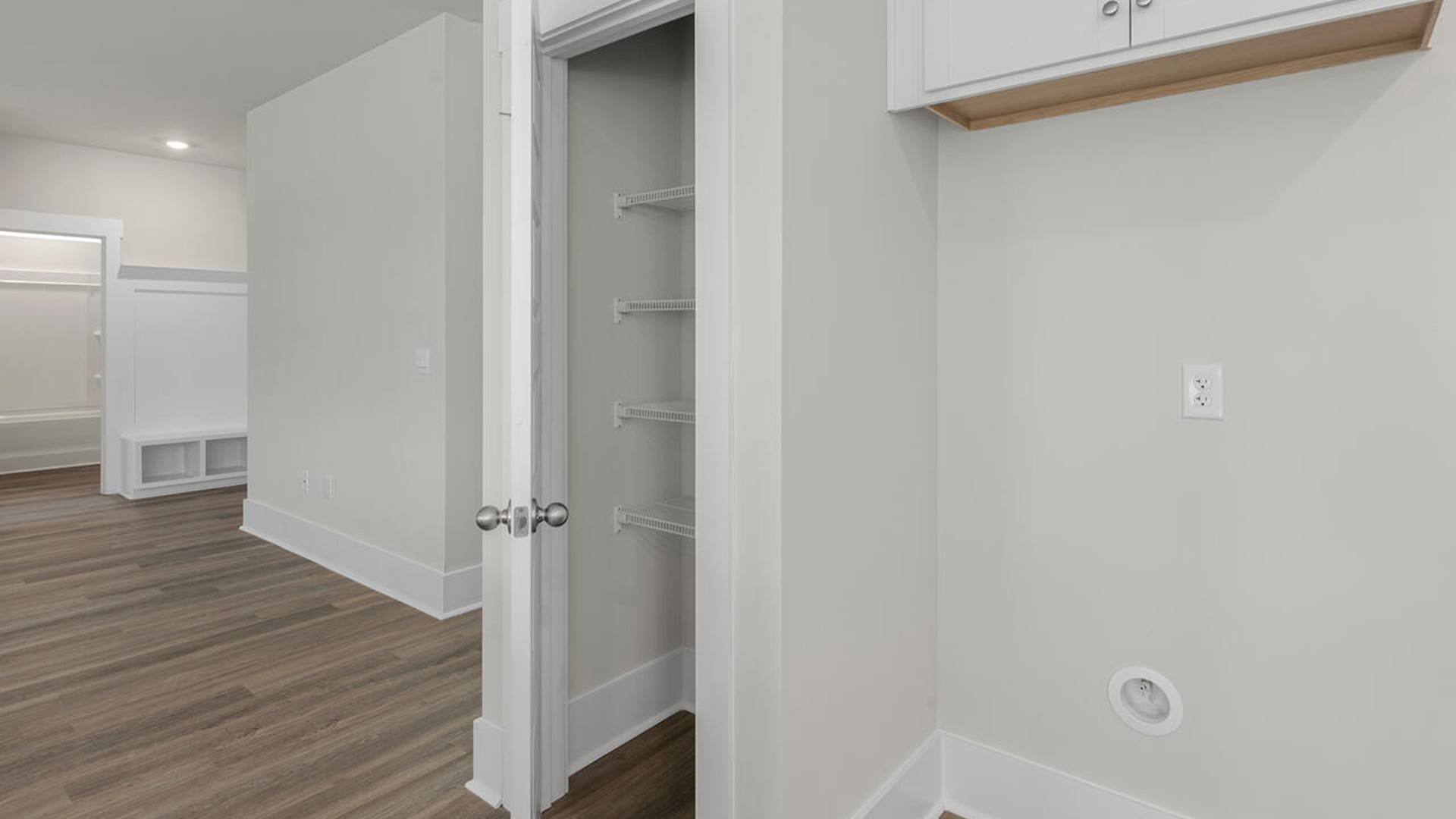 On the first floor, the formal dining room is ideally located next to a spacious open-concept living area and kitchen, allowing for effortless interaction with guests while preparing meals.