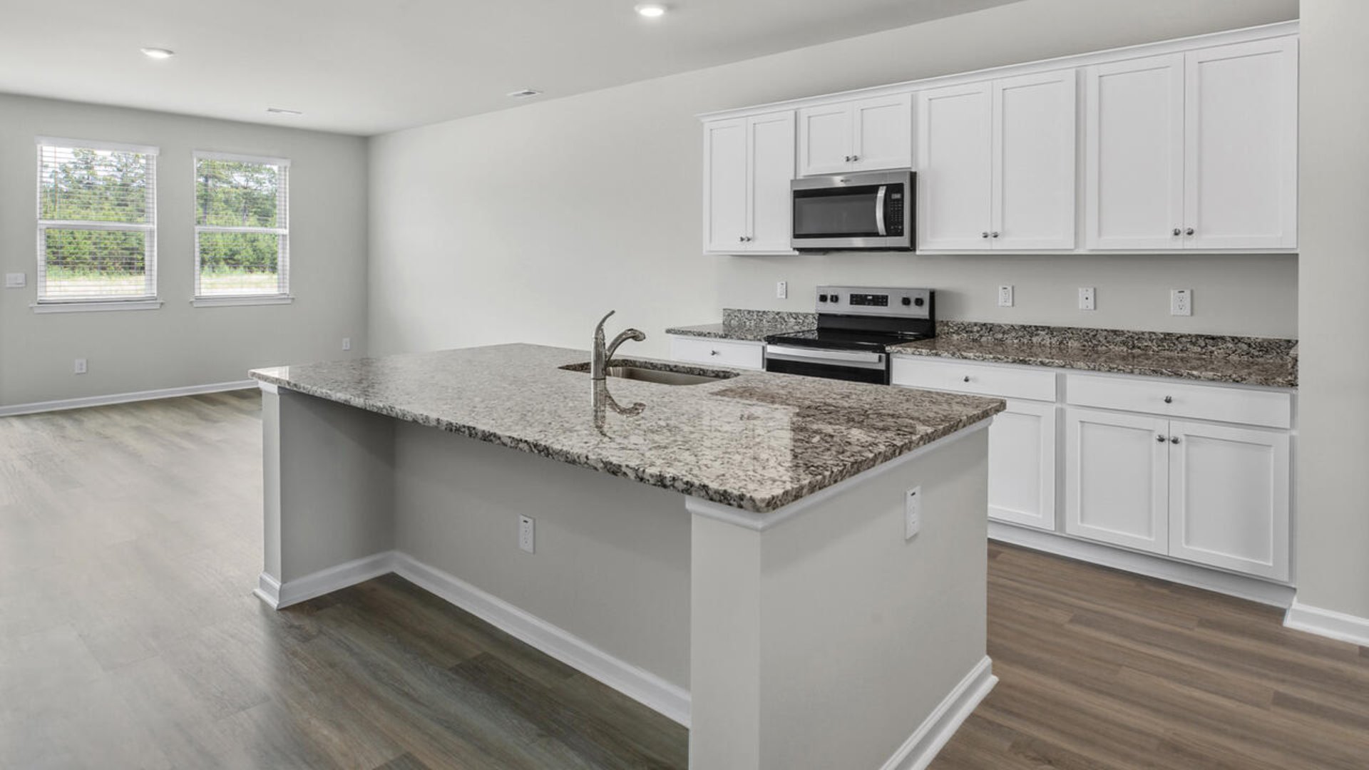 As you enter the home you will find a formal dining room, open concept kitchen and family room with additional seating at the large kitchen island, and a first floor primary bedroom retreat.