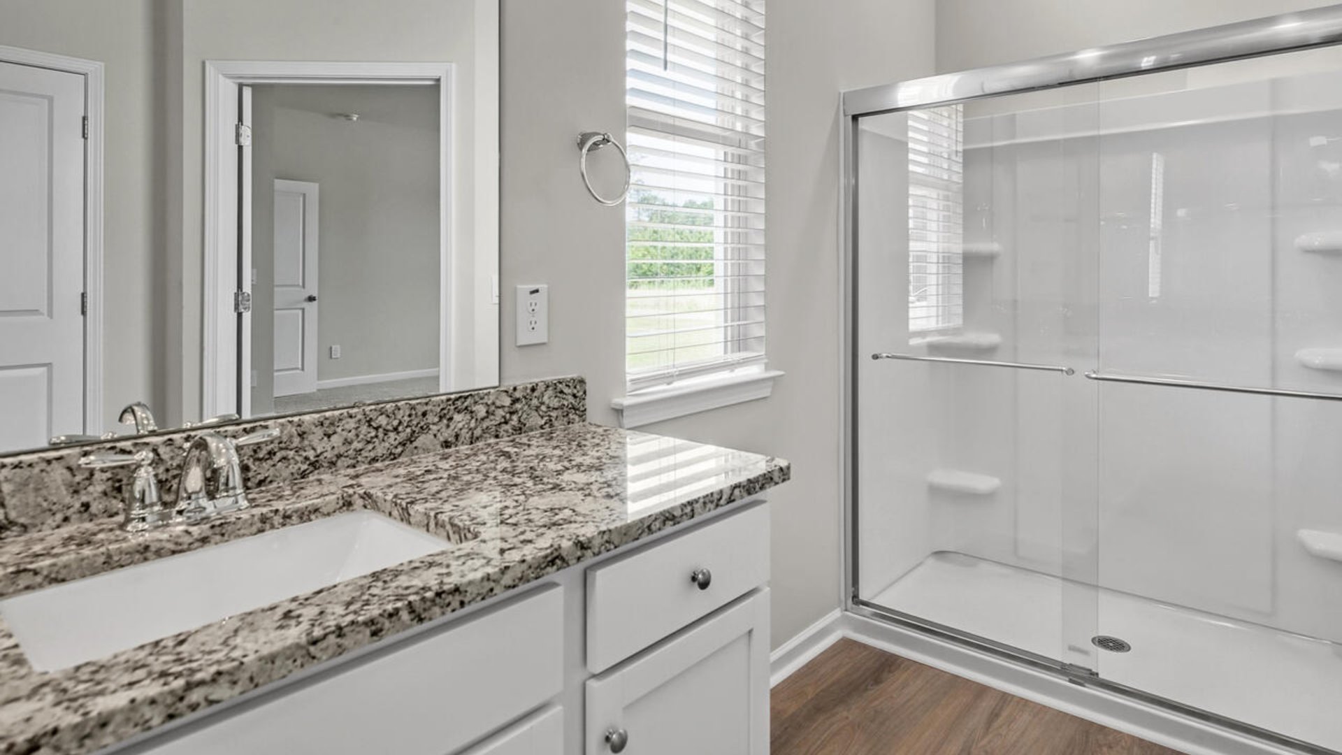 The primary bedroom has its own attached bathroom that features a walk-in closet and all the space you need to get ready in the morning.