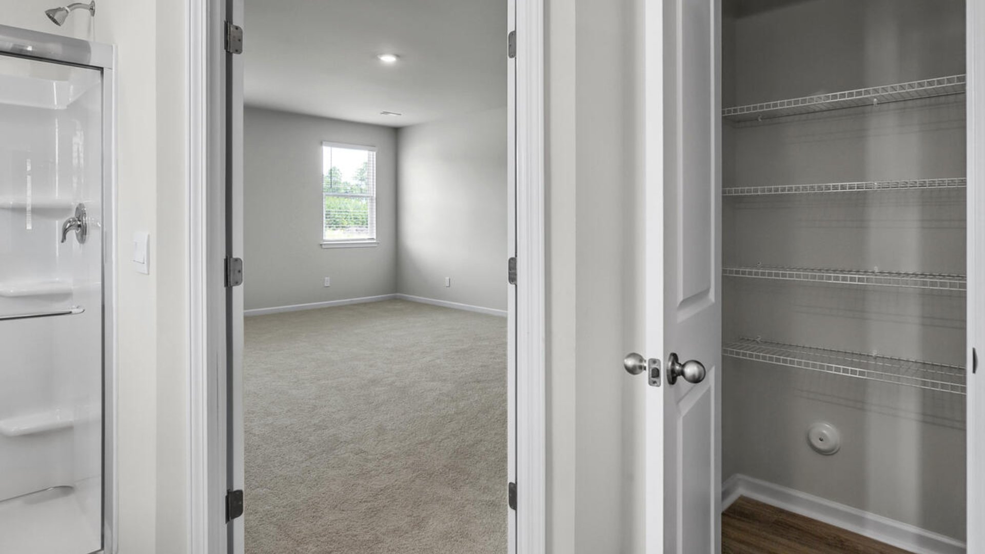 The primary bedroom has its own attached bathroom that features a walk-in closet and all the space you need to get ready in the morning.