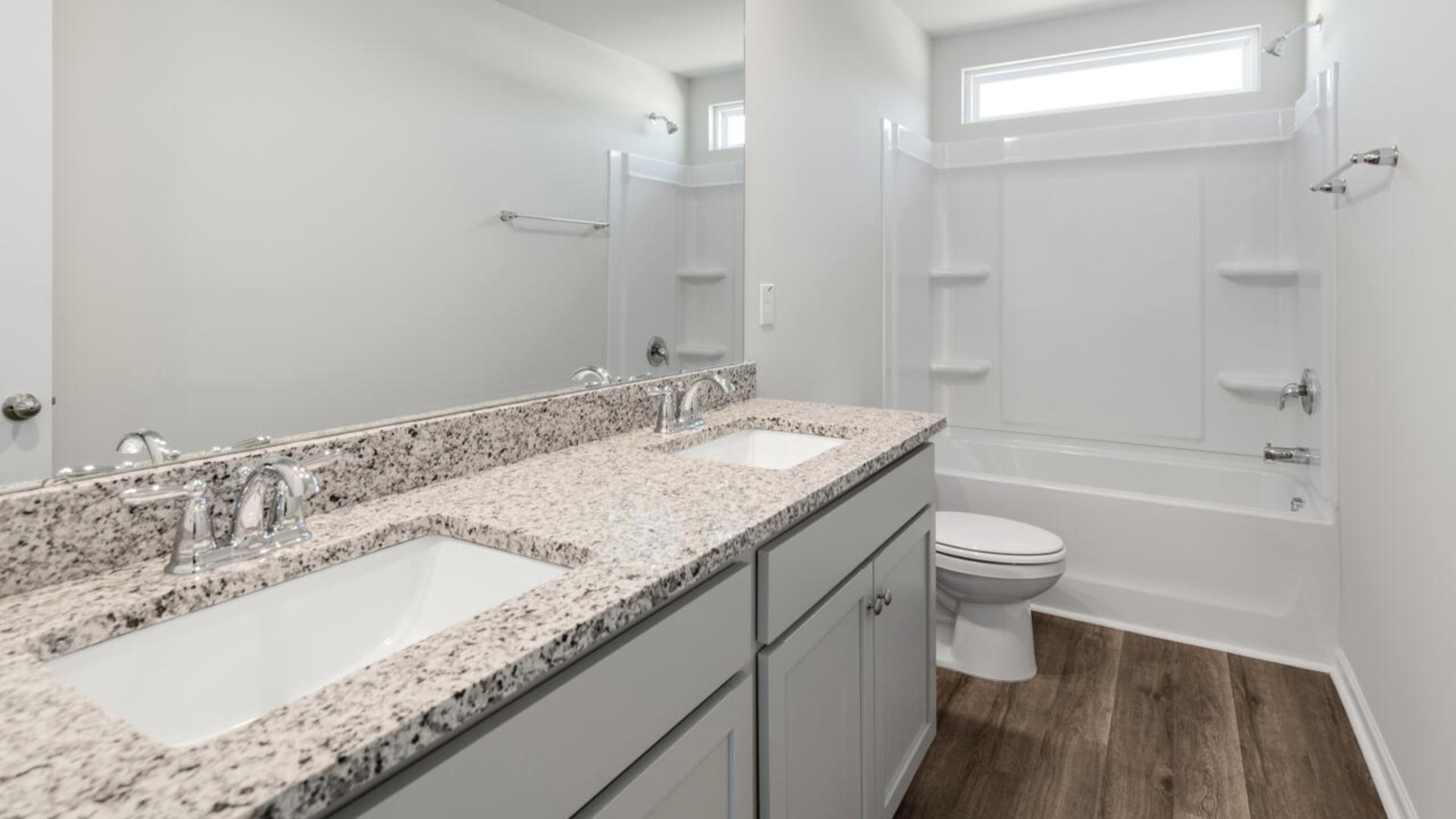The primary bedroom has its own attached bathroom that features a walk-in closet and all the space you need to get ready in the morning. Sharing a sink isn’t a worry with the double vanity, and you also get additional privacy with a separate door for the toilet and shower.