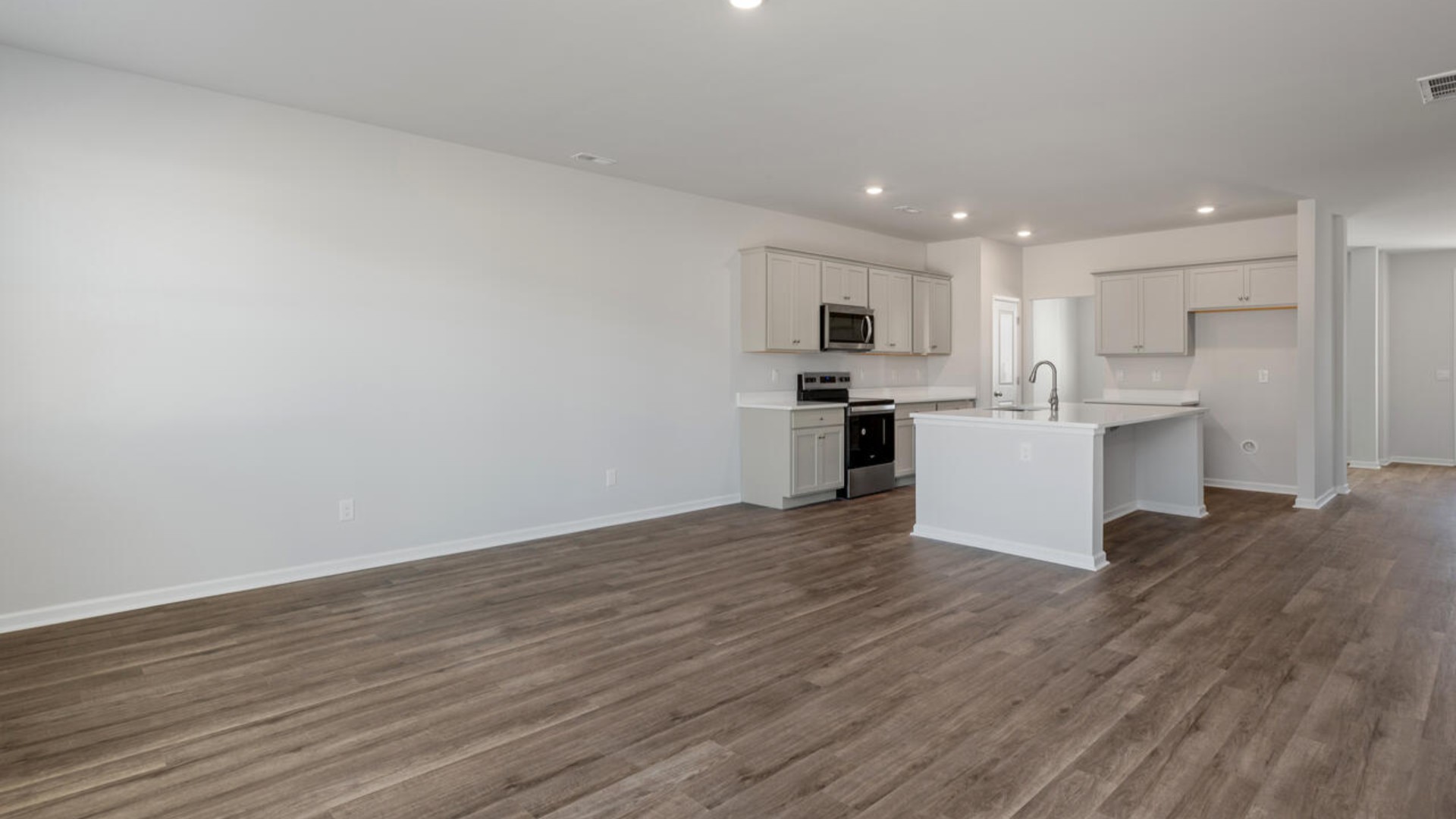 The home features a spacious design with modern touches. With its elegance, functionality, and prime location, the Tillman delivers an exceptional lifestyle in Sneads Ferry's most sought-after communities.