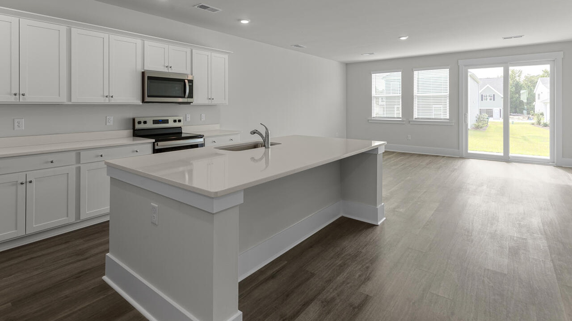 As you enter the home you will find a formal dining room, open concept kitchen and family room with additional seating at the large kitchen island, and a first floor primary bedroom retreat.