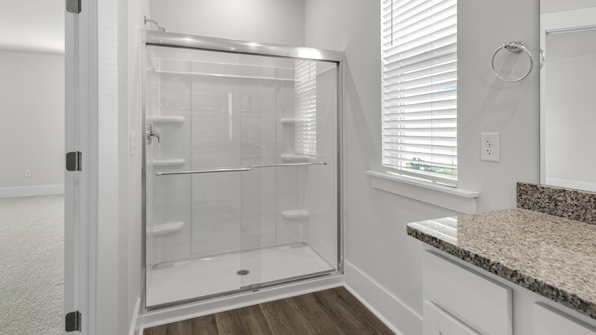 As you enter the home you will find a formal dining room, open concept kitchen and family room with additional seating at the large kitchen island, and a first floor primary bedroom retreat.